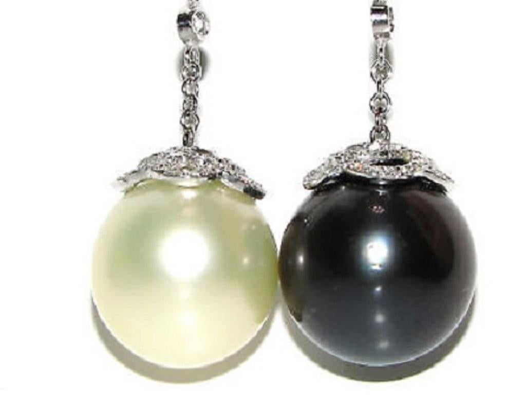 15mm Natural South Sea Pearl & Tahitian Pearl

The Black White classic Cluster Dangle

White / Cream Color

Grey / Black color

4.00ct. diamonds

G-color, Vs-2 clarity.

Measures: 

3 1/4 inches long

14kt. white gold

18.1 grams

Appraisal: $13,000 