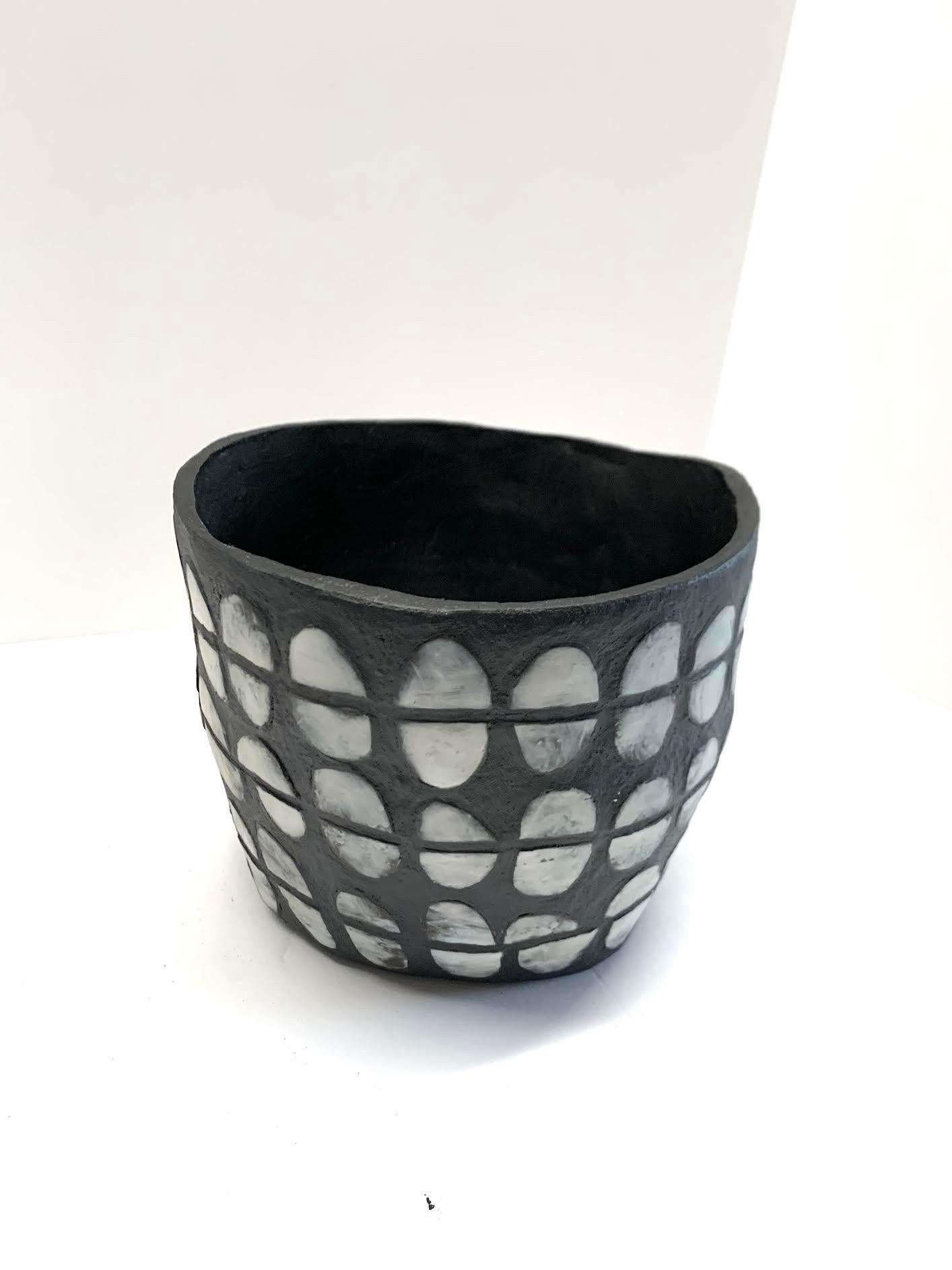Contemporary American ceramicist Brenda Holzke hand made unique one of a kind stoneware vase made of dark stoneware and porcelain slip.
Wide neck and split oval design.