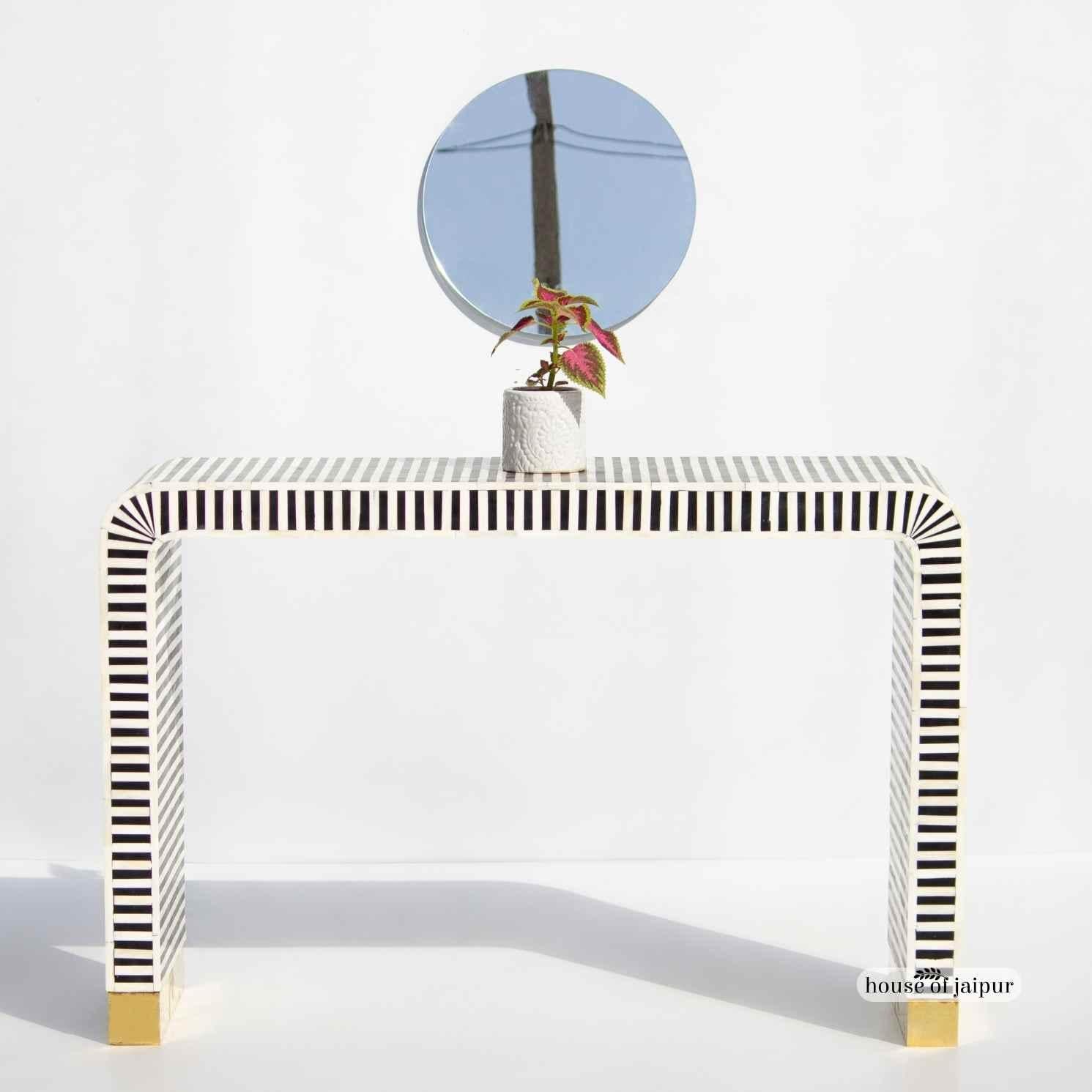 Our Bone Inlay Console Table is a striking and modern addition to any entryway, hallway or living space. Designed in a timeless black-and-white palette, the console features a clean linear stripe pattern handcrafted using individually cut bone