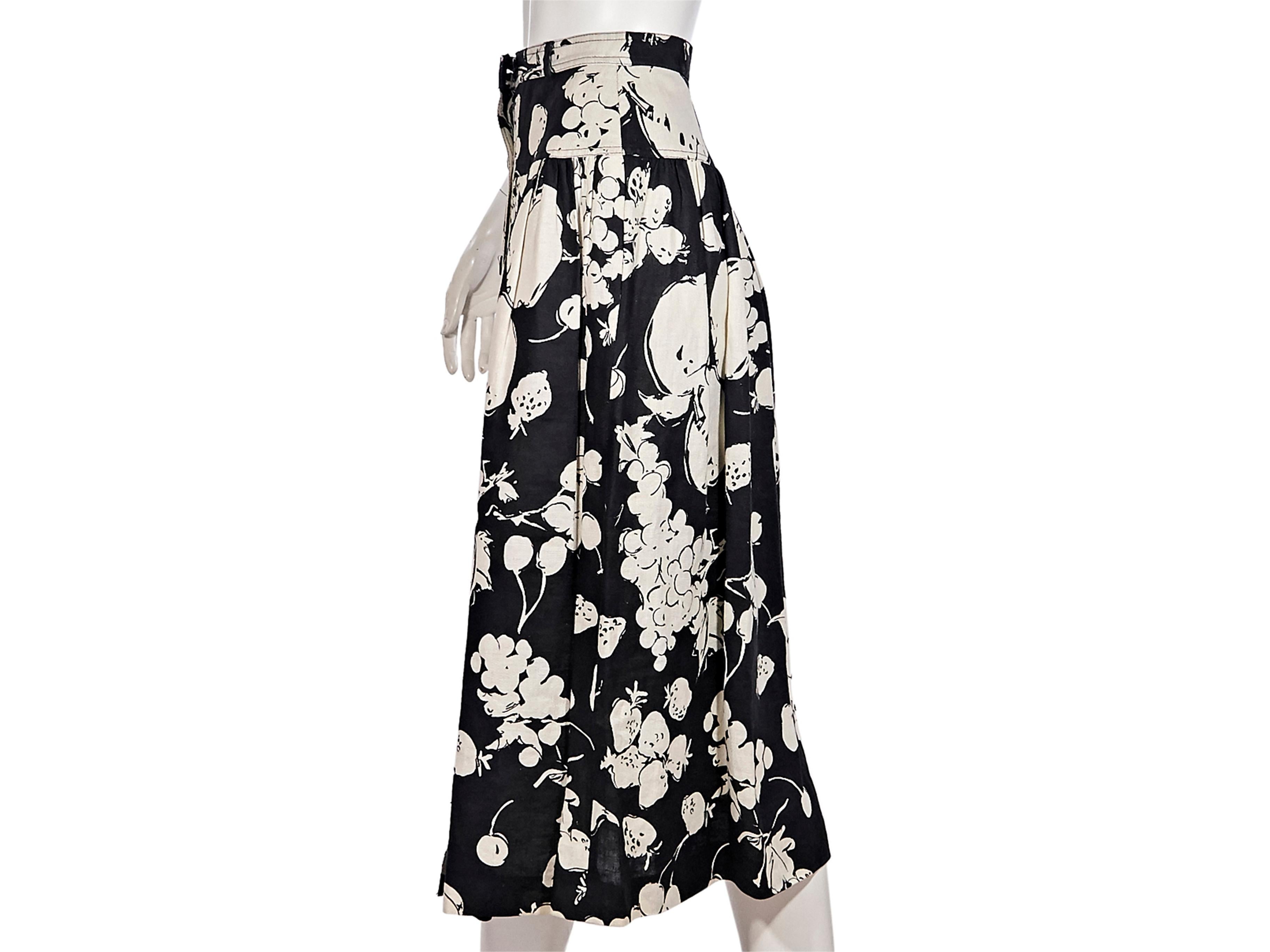 Product details:  Vintage black and white fruit-printed linen skirt by Valentino.  Banded waist.  Button-front closure.  24