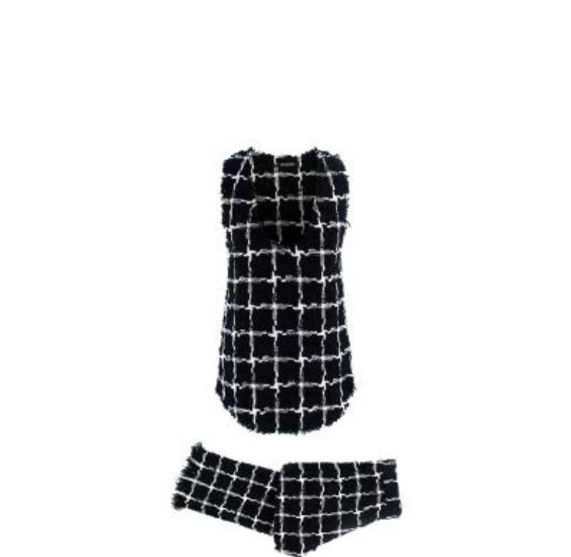 Balmain Black & White Windowpane Tweed Top & Trousers
 

 - Textured boucle tweed with a white large-scale windowpane check on a black base
 - Scoop neck, curved hem sleeveless shell top
 - Tailored, straight leg trousers with zip fly and side