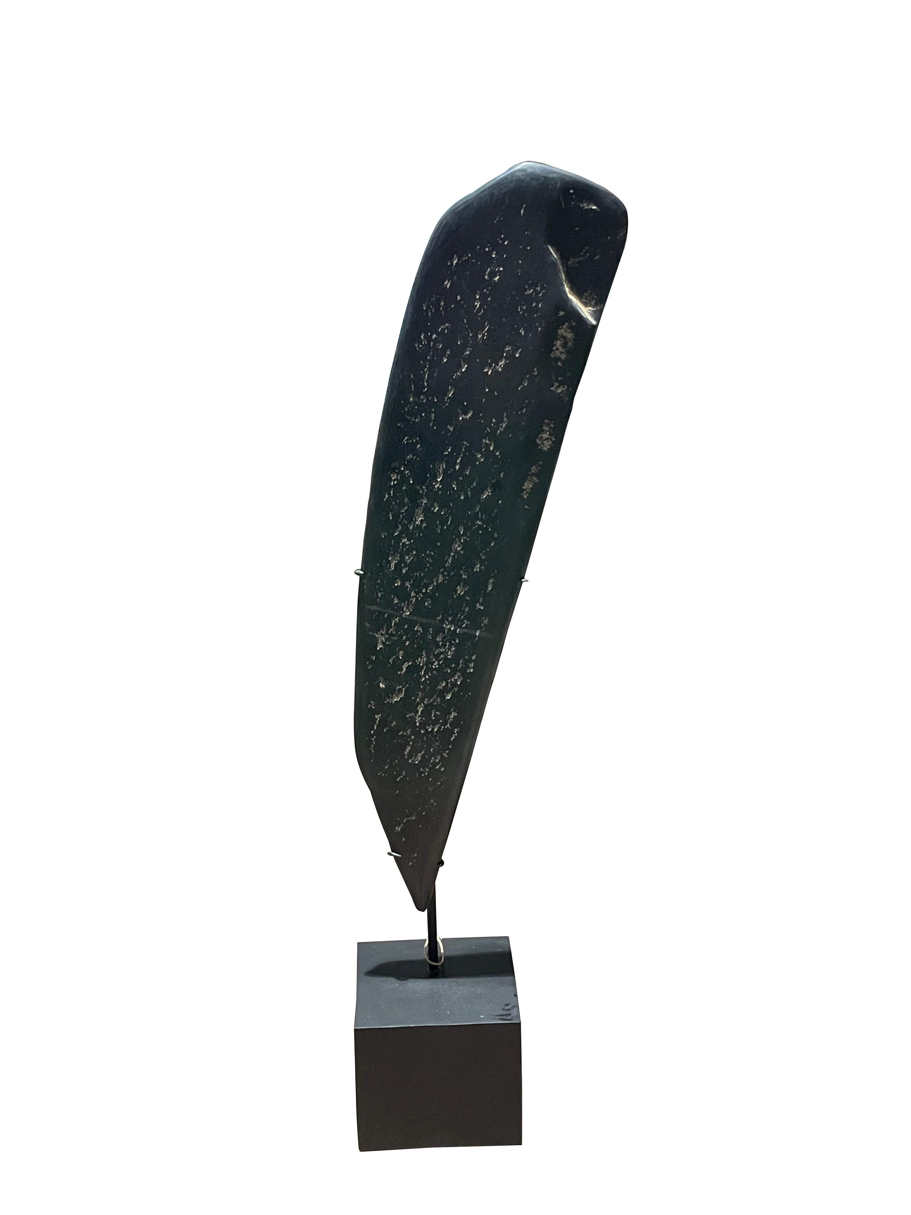 19th century Indonesian smooth black stone paddle sculpture.
Subtle white markings.
Mounted on steel stand.
Two available and sold individually.

