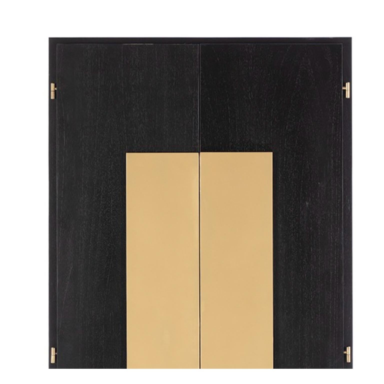 Black Wood And Golden Metal Wardrobe by Thai Natura
Dimensions: D 45 x W 85 x H 195 cm.
Materials: Black wood and golden metal.

THAI NATURA is a company that designs, produces and commercializes furniture, lighting and decorative items. Our company
