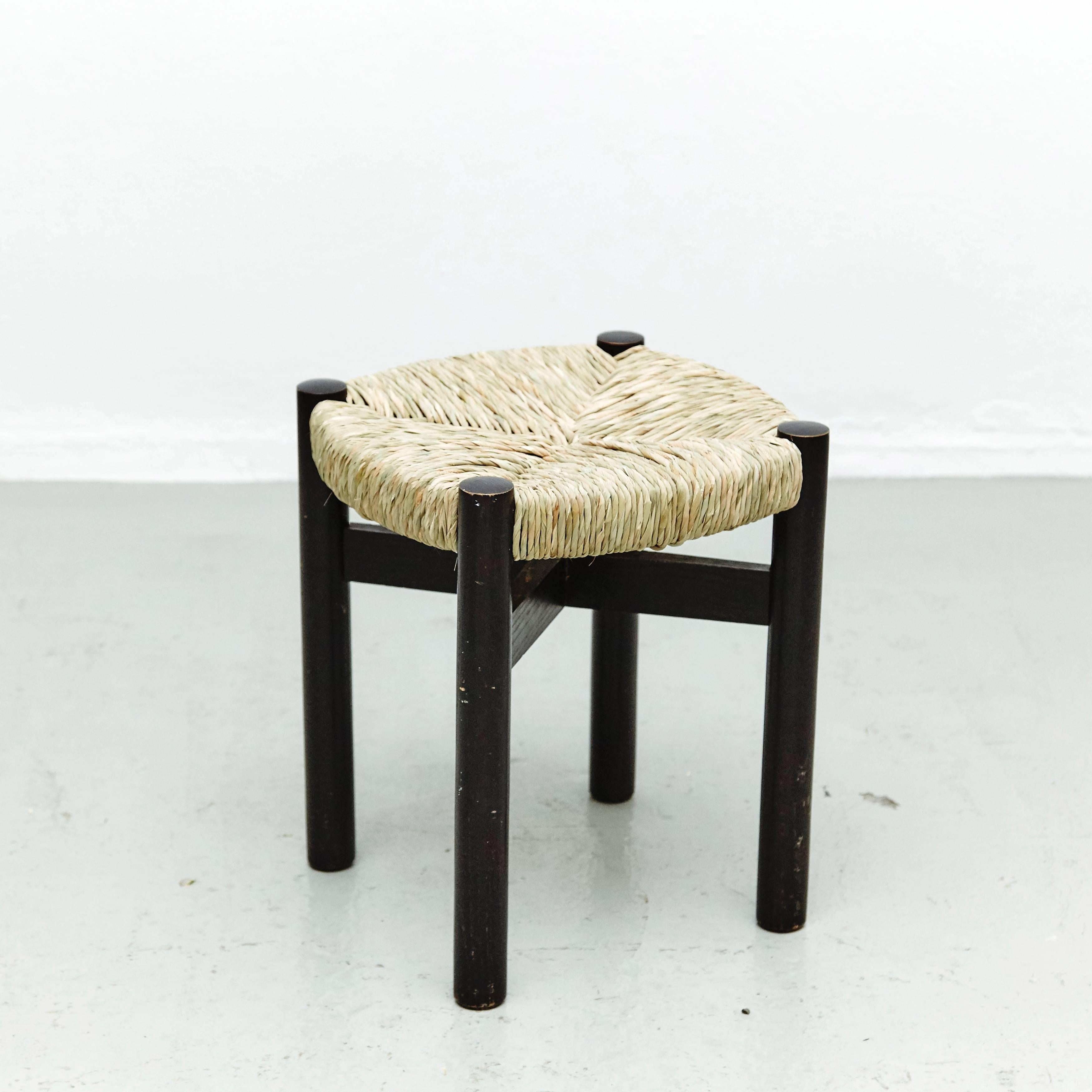 Stool, model meribel, designed by Charlotte Perriand, circa 1950.
Manufactured in France.
Wood and renewed rattan. Black lacquer.

In good condition, with minor wear consistent with age and use, preserving a beautiful patina.

Charlotte
