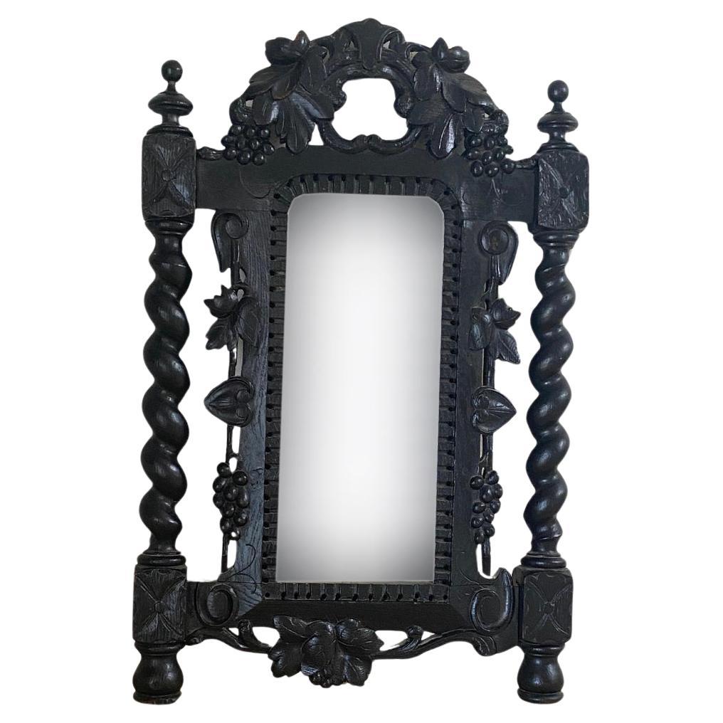 Ce miroir est en bois, de couleur noire. Il est de style et d'époque Art nouveau.
Il a été fabriqué à Autria vers 1900.
