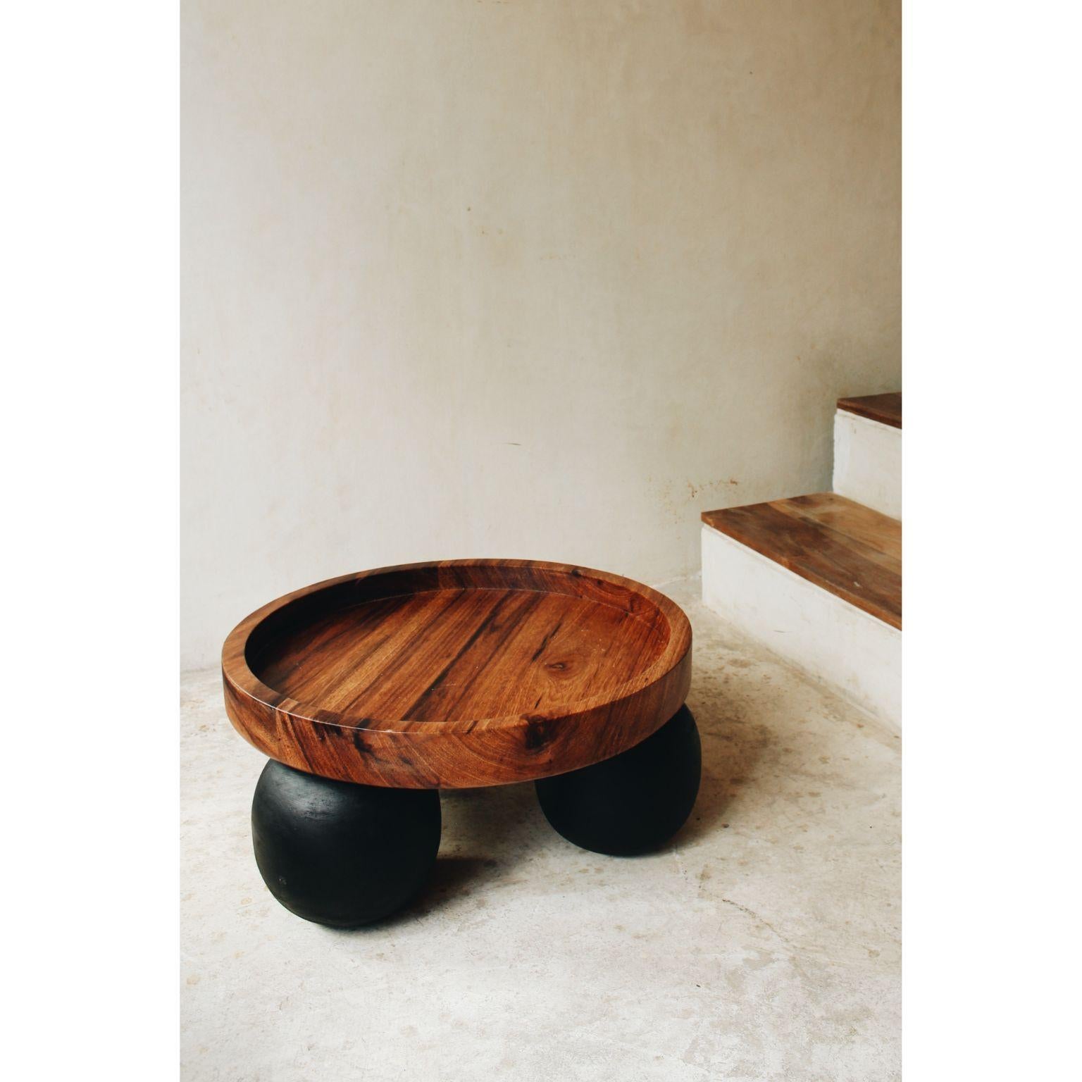 Black wooden balls table with solid wood top by Daniel Orozco
Dimensions: D 55 x H 20 cm
Materials: Wood

Daniel Orozco Estudio
We are an inclusive interior design estudio, who love to work with fabrics and natural textiles in makes our spaces