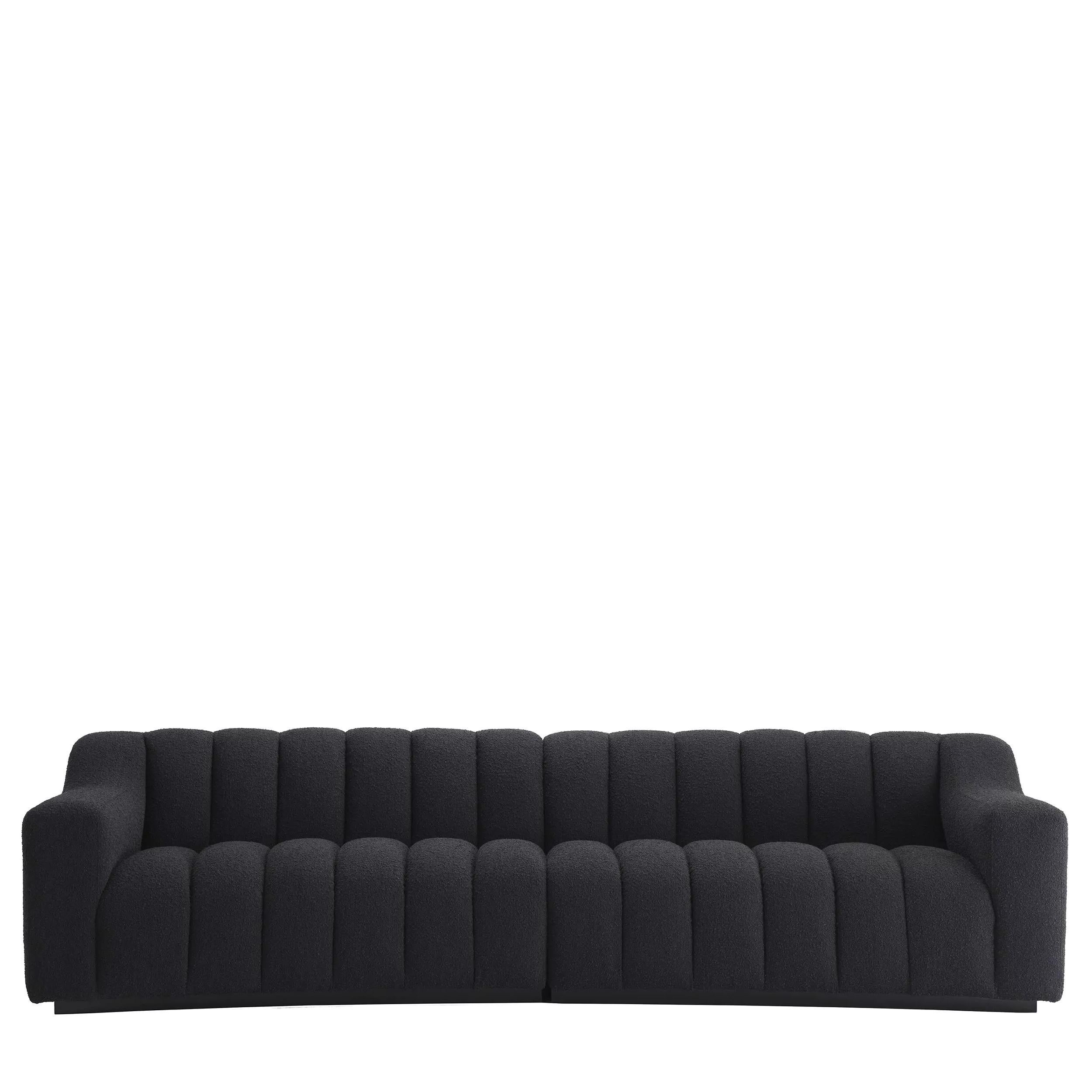 Scandinavian design and vintage style black wooden feet and black bouclé fabric curved padded large sofa.