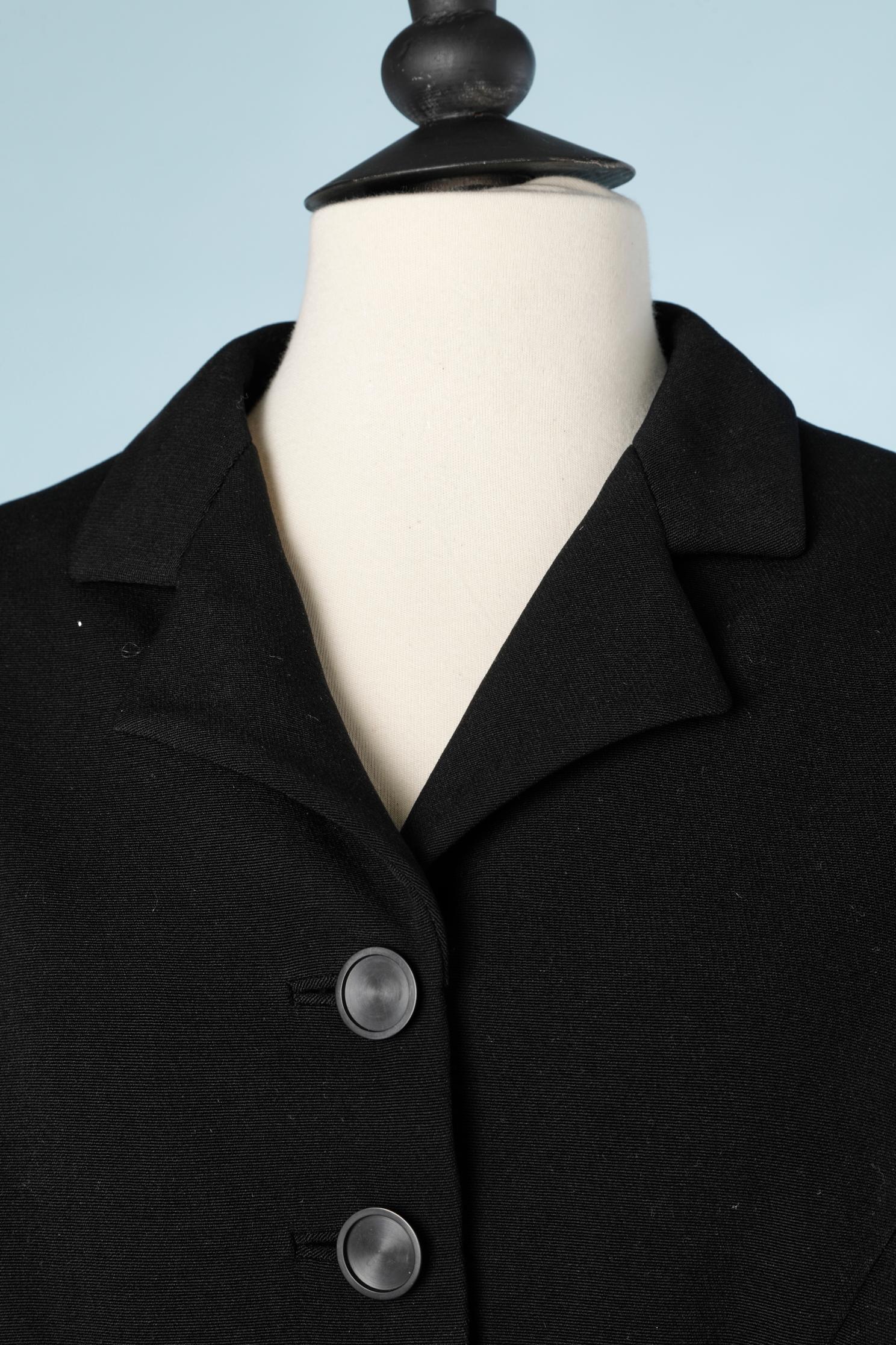 Black wool and silk single breasted jacket  with embossed stripes.
SIZE L