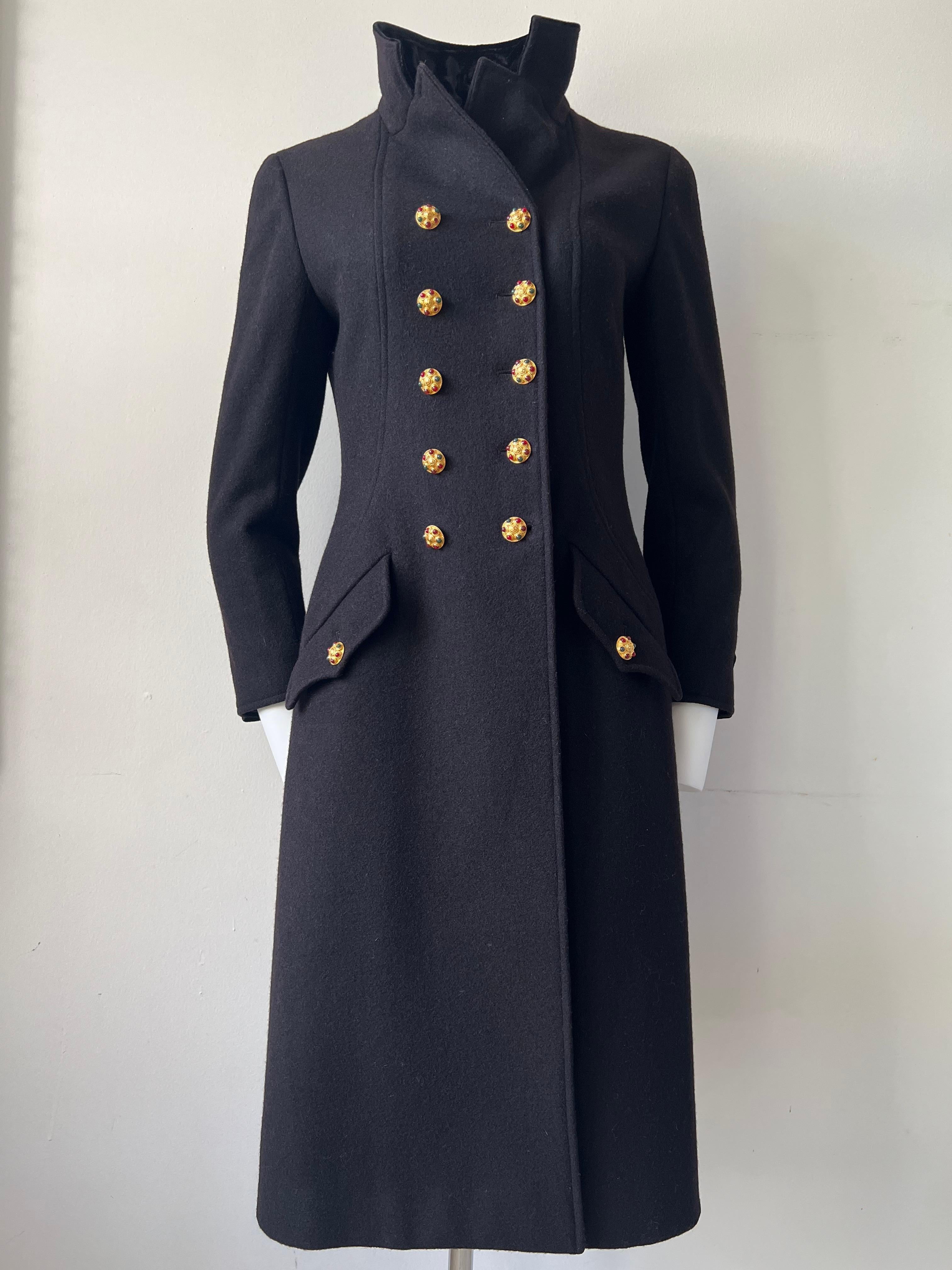 Extraordinary officer's coat in wool and black velvet, double row of ten Gripoix Chanel buttons. Two buttons on the pockets, Three on the back of each sleeve. A velvet band has two buttons on the back of the jacket. Silk lining. Chanel year 1996. 