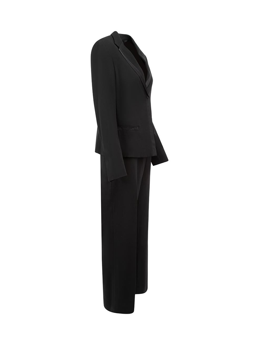 CONDITION is Never Worn. No visible wear to set is evident on this used Max Mara designer resale item.



Details


Black

Wool

Blazer and trousers set

Long sleeved blazed

Snap button fastening

Satin trim

2x Front pockets

Wide leg trousers

2x