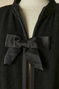 Black wool coat with bow and satin edge CHANEL
