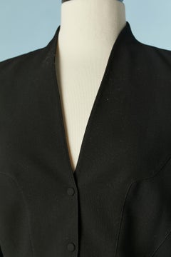 Black wool crêpe skirt-suit with see-through inset on the sleeves Thierry Mugler