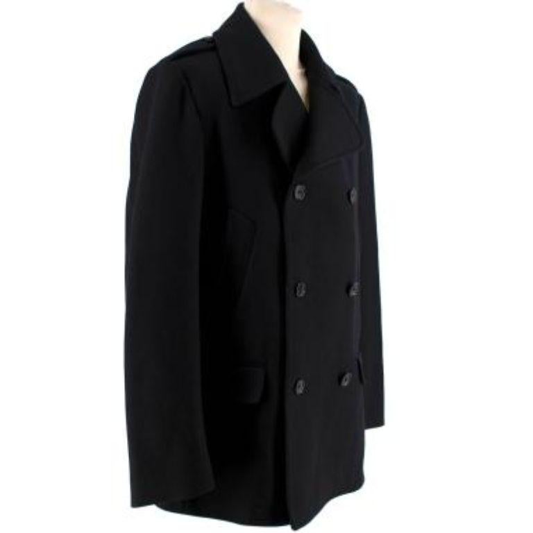 Dolce & Gabbana Black Wool Double Breasted Coat
 

 -Two side flap pockets
 -Slant pockets
 -Fully lined 
 -Button fastenings through double-breasted front
 -Weighted fabric
 -Epaulettes
 

 Material: 
 80% Wool 
 20% Nylon 
 

 PLEASE NOTE, THESE