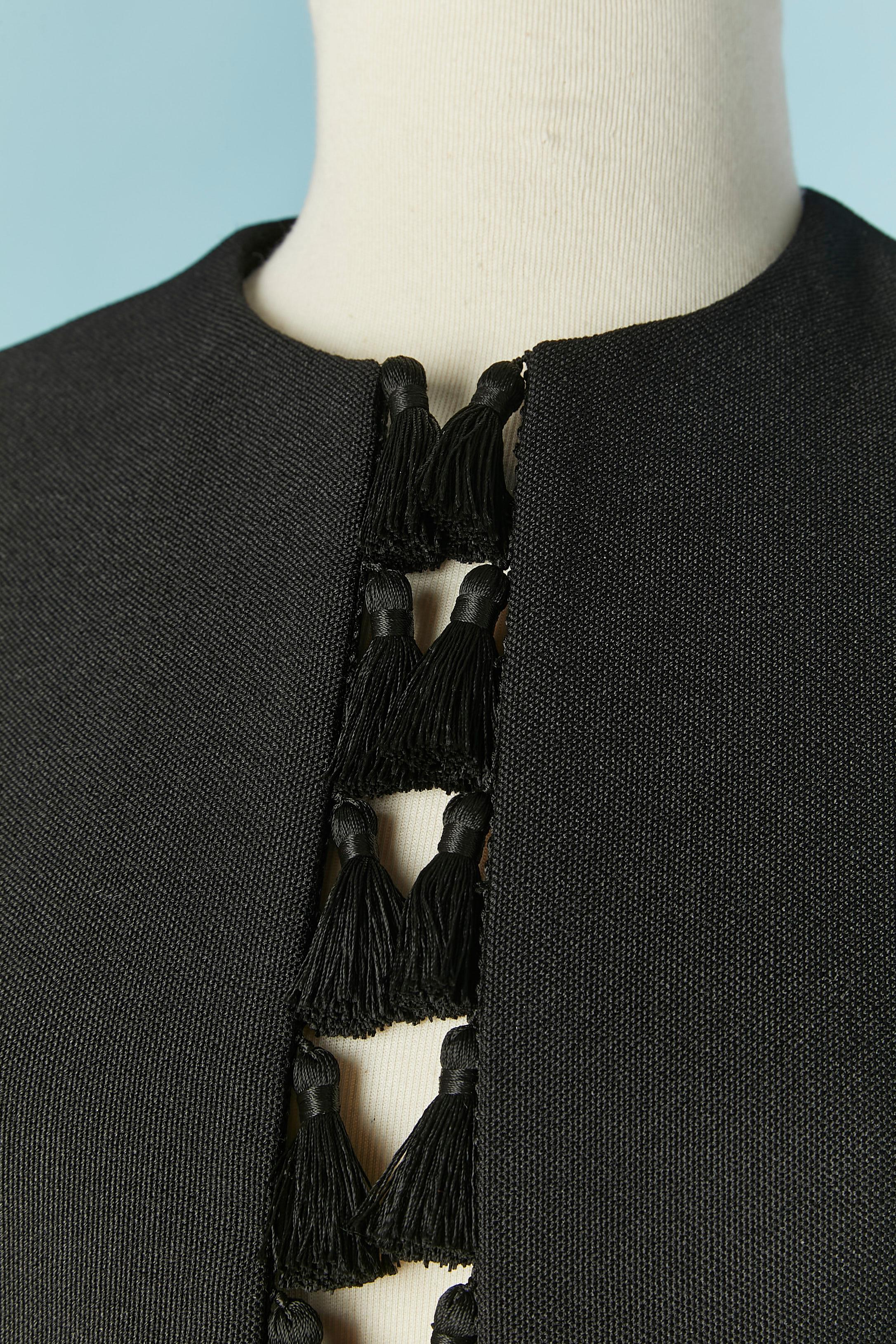 Black wool edge to edge jacket with tassel edge. No lining but piping 
Pocket on both side with pocket flap.
SIZE 36 (Fr) S 