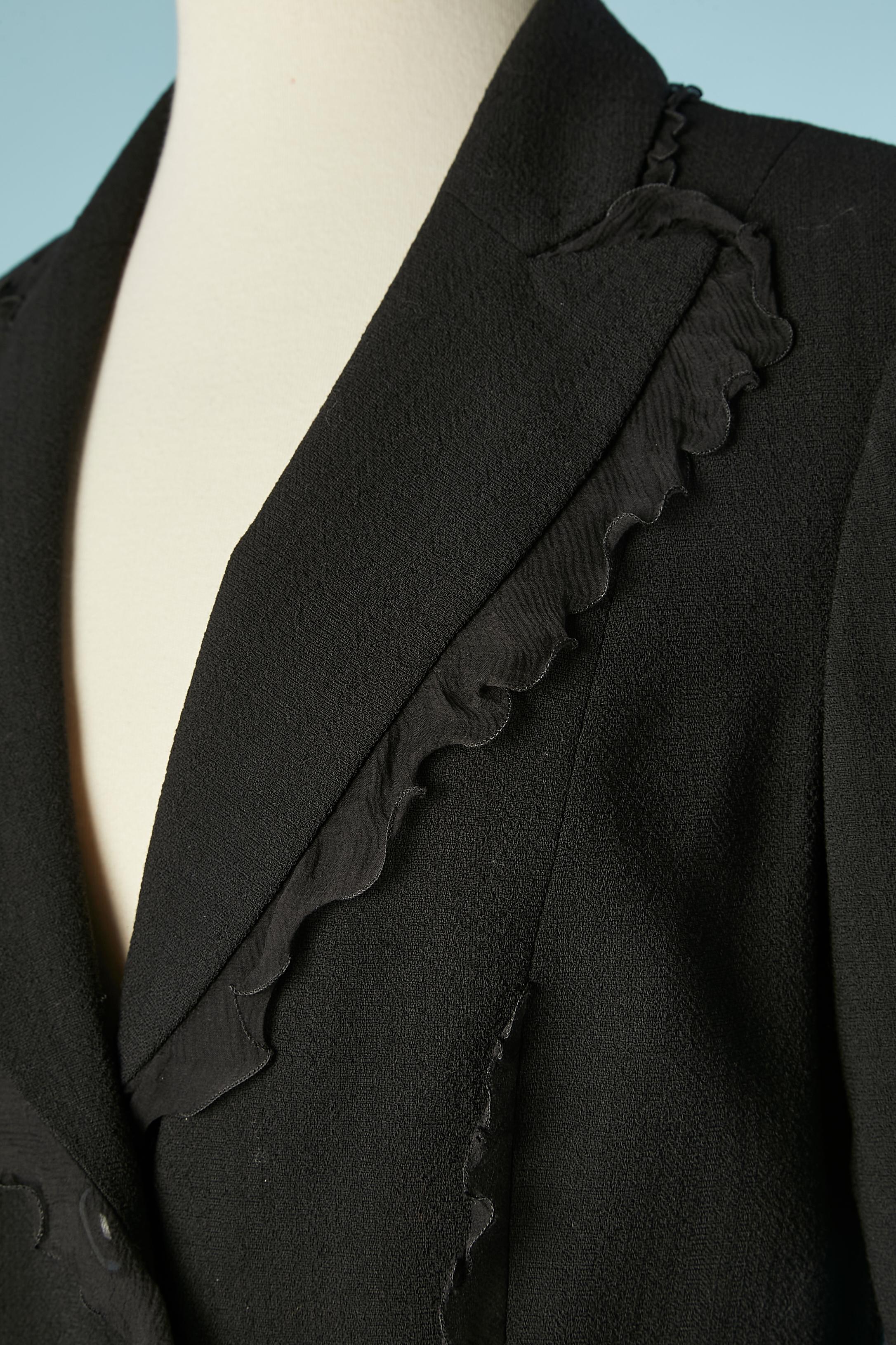 Black wool jacket with black silk chiffon ruffles. 
Lining composition: acetate and rayon. 
SIZE 44 (It) 40 (Fr) 10 (Us) 