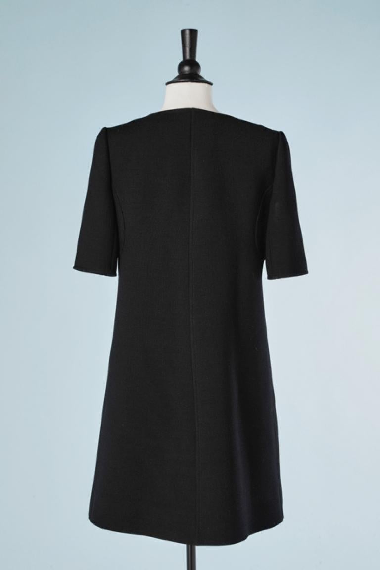 Black wool minidress with button in the middle front Courrèges  In Excellent Condition In Saint-Ouen-Sur-Seine, FR