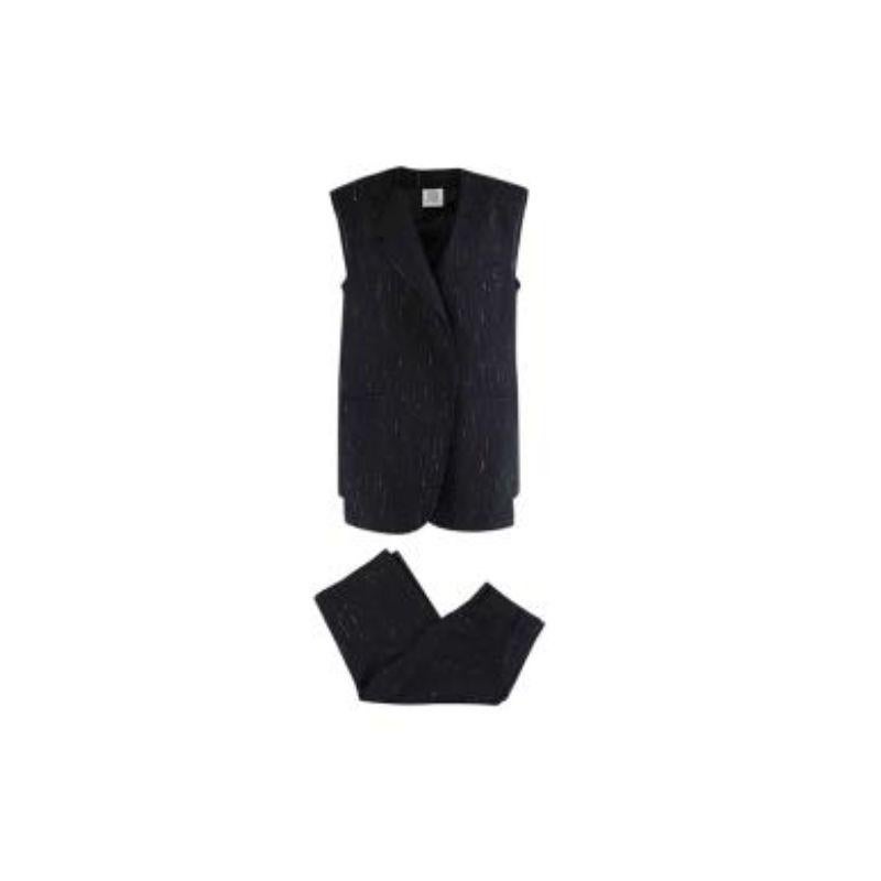 Vetements black wool pinstripe raw edge jacket & shorts
 
 - Midweight pinstripe wool cloth, with intentionally distressed raw edges, giving a deconstructed feel
 - Sleeveless, double-breasted jacket with asymmetric collar
 - Inset hip pockets
 -