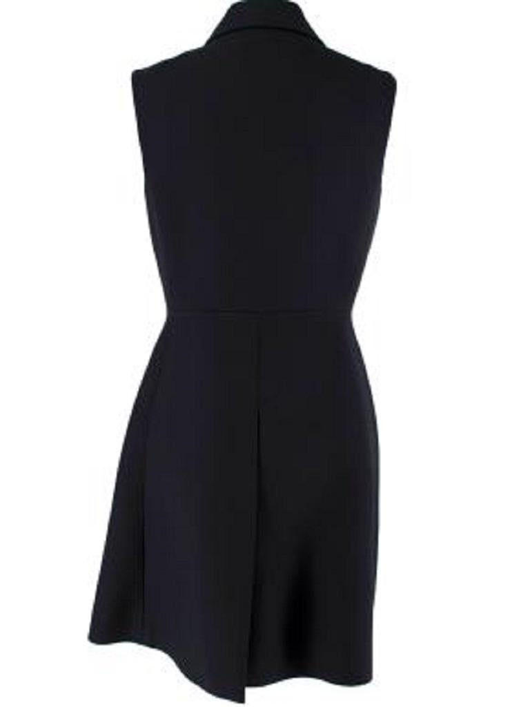 Prada TBlack Wool-Silk Crepe Embellished Collar Shirt Dress
 

 - Short, sleeveless shirt dress with half placket button front, and crystal-embellished point collar
 - Fitted silhouette with a defined waistline 
 - Side slip pockets
 - Back split
 -