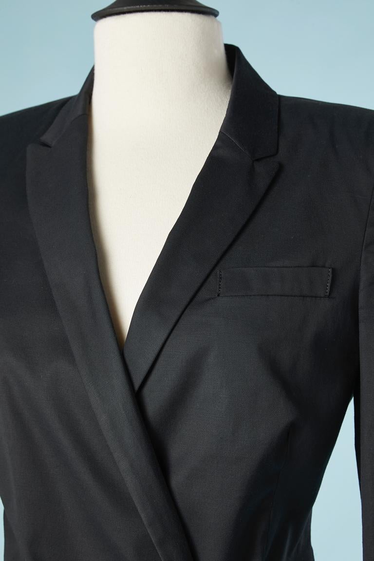 Black wrapped and drape cotton skirt-suit. Shoulder pad. Double-breasted jacket close with one inside button and a hook on the other side. Fabric composition: 54% rayon, 43% cotton, 3% stretch. Lining: 100% rayon 
Size 42 ( But fit M) 