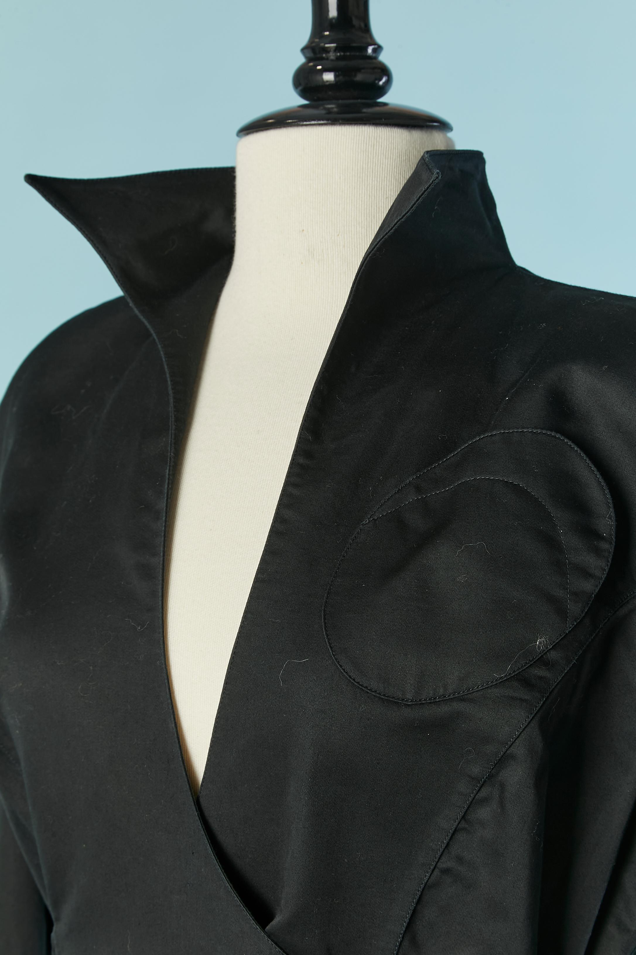 Black wrapped cotton dress. Shoulder pad. Pocket on both side + one top left pocket. 
Buckle closure on the middle back which make the belt size adjustable. Snap closure inside.
SIZE 44 (Fr) L 
