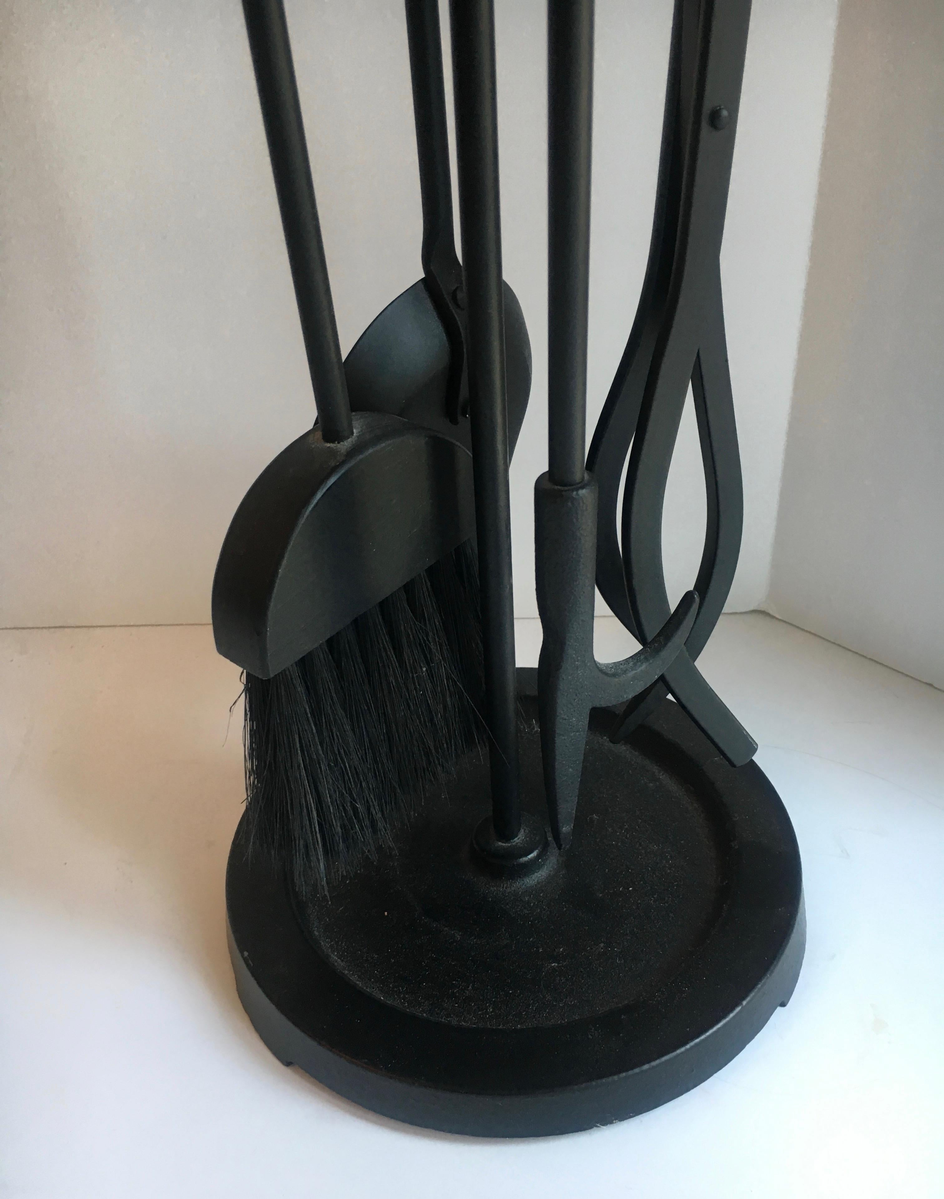 Five-piece black wrought iron fireplace tools with brass handles and stand - perfect for the clean and modern interior - all five pieces are very functional: Poker, brush, tongs, shovel.