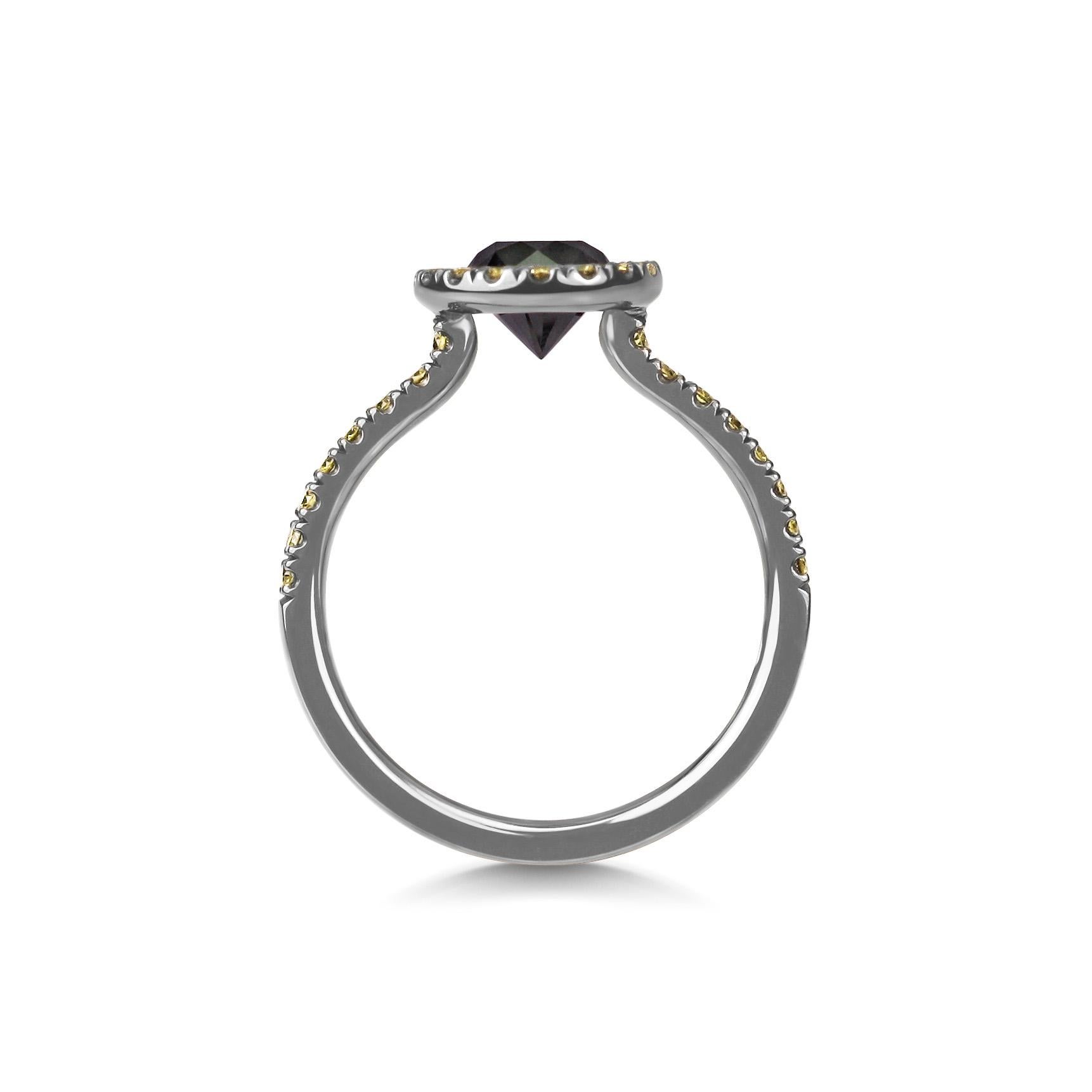 The dark depths of black diamond, surrounded by the twinkling yellow diamonds, encapsulated in 'shadow gold'

This unique ring is handmade in 18k White Gold and has been plated with Black Rhodium to give the smokey mysterious finish. 

The center