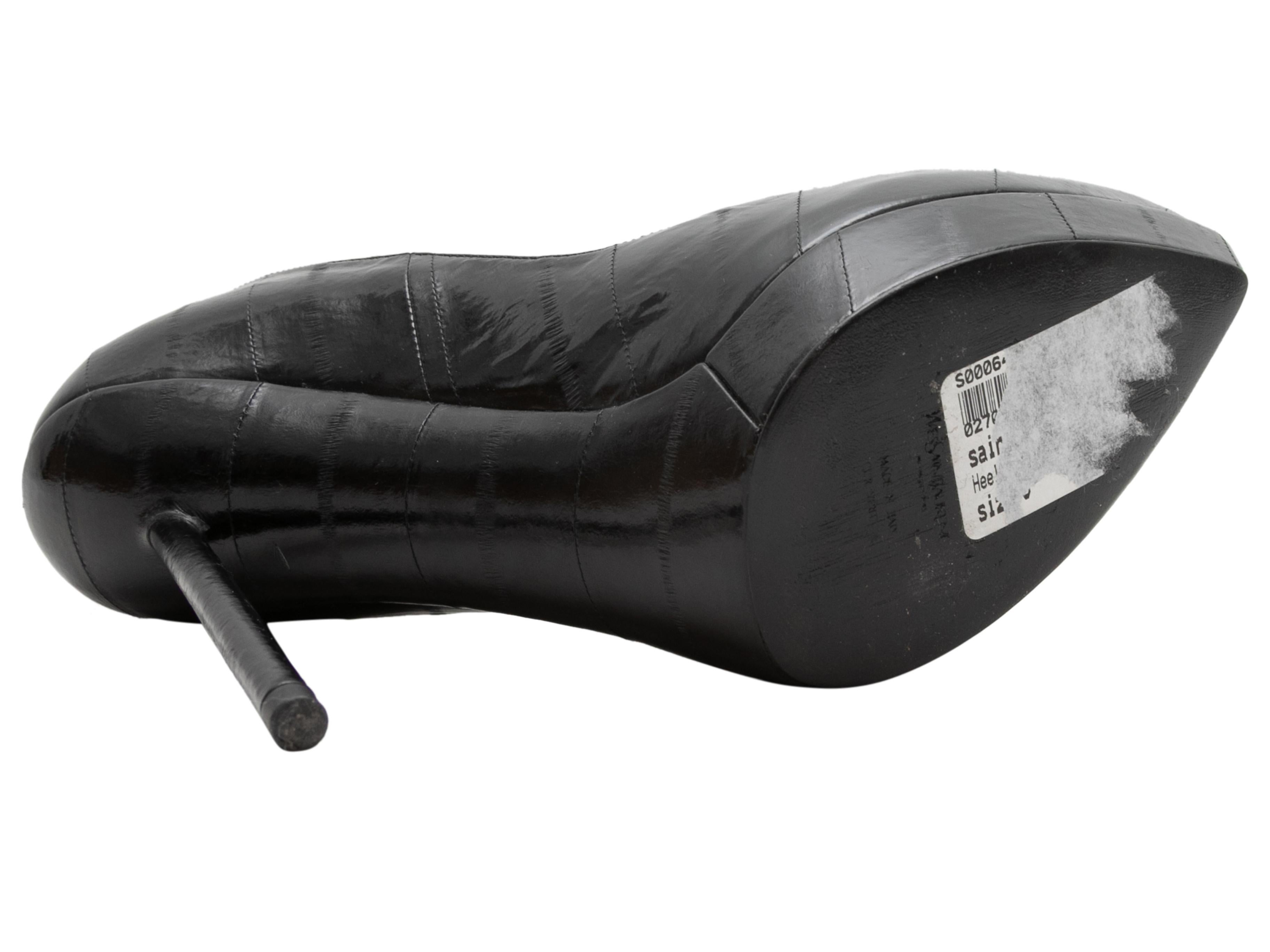 Black embossed croc leather pointed-toe platform pumps by Yves Saint Laurent. 1.5