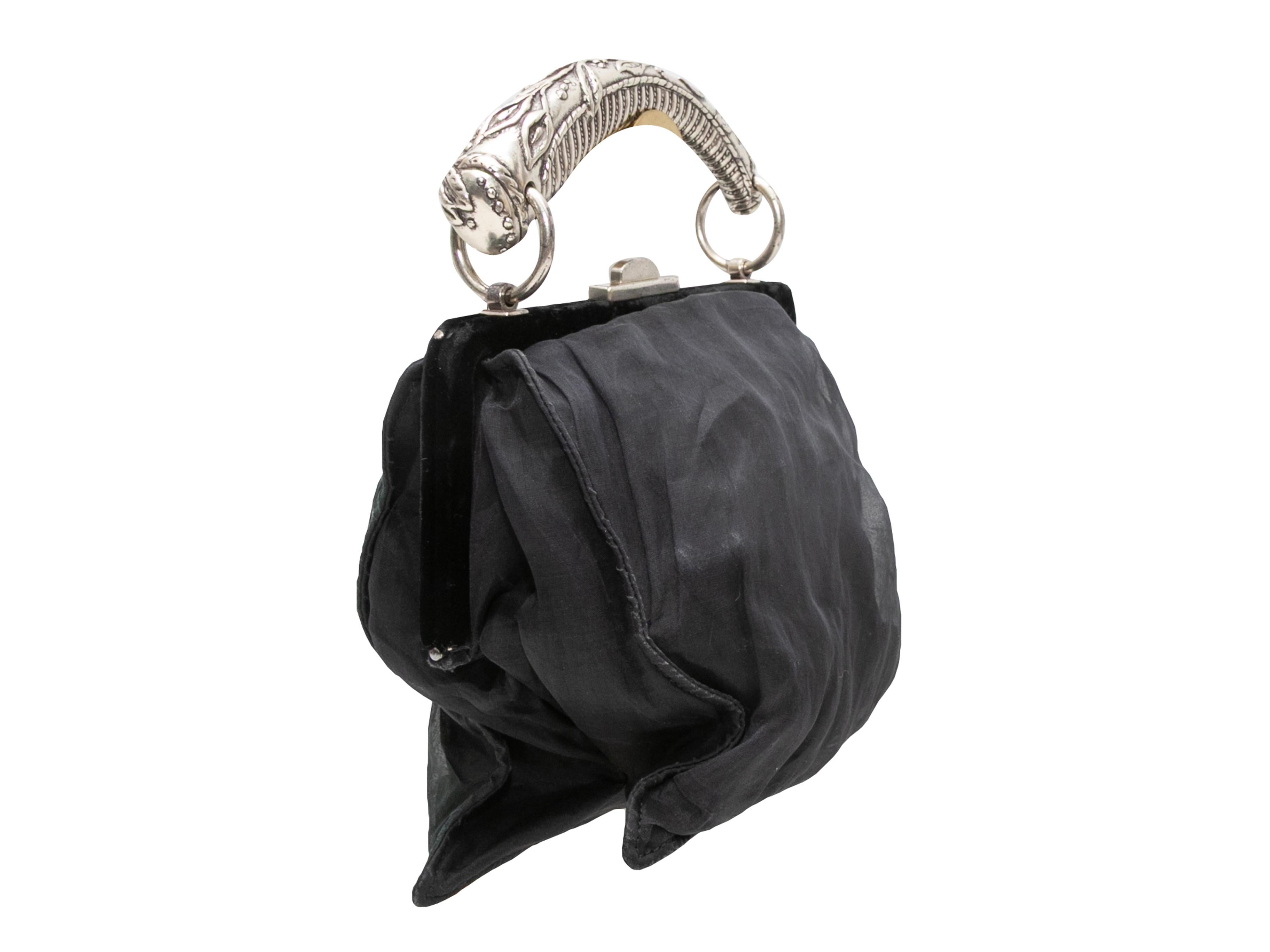 Product Details: Black Yves Saint Laurent Mombasa Handbag. The Mombasa Handbag features a textile body, silver-tone hardware, single top handle, and top clasp closure. 9