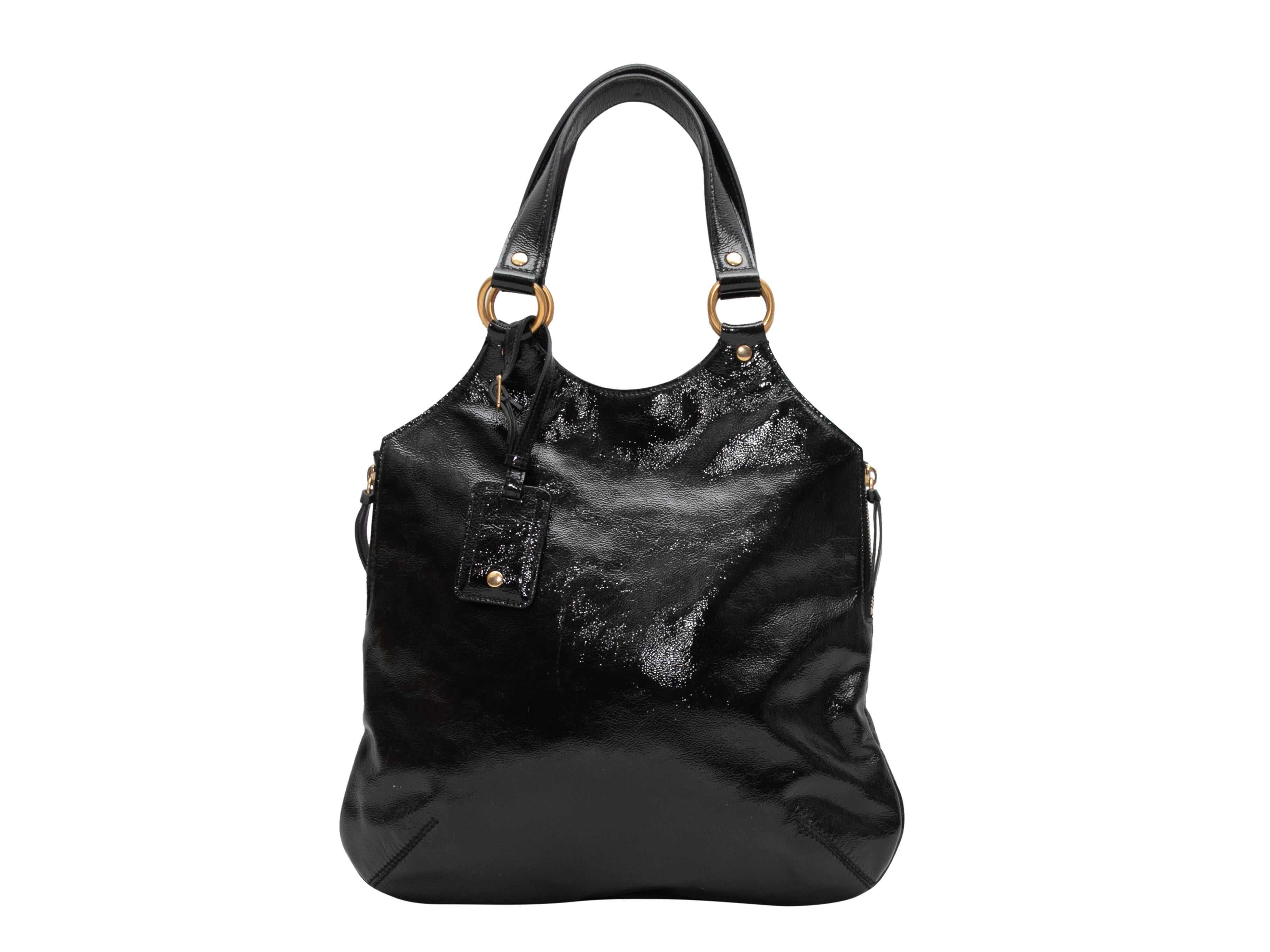 Black Yves Saint Laurent Patent Leather Handbag. This handbag features a patent leather body, gold-tone hardware, dual top handles, zip accents at sides, and a magnetic top closure. 13