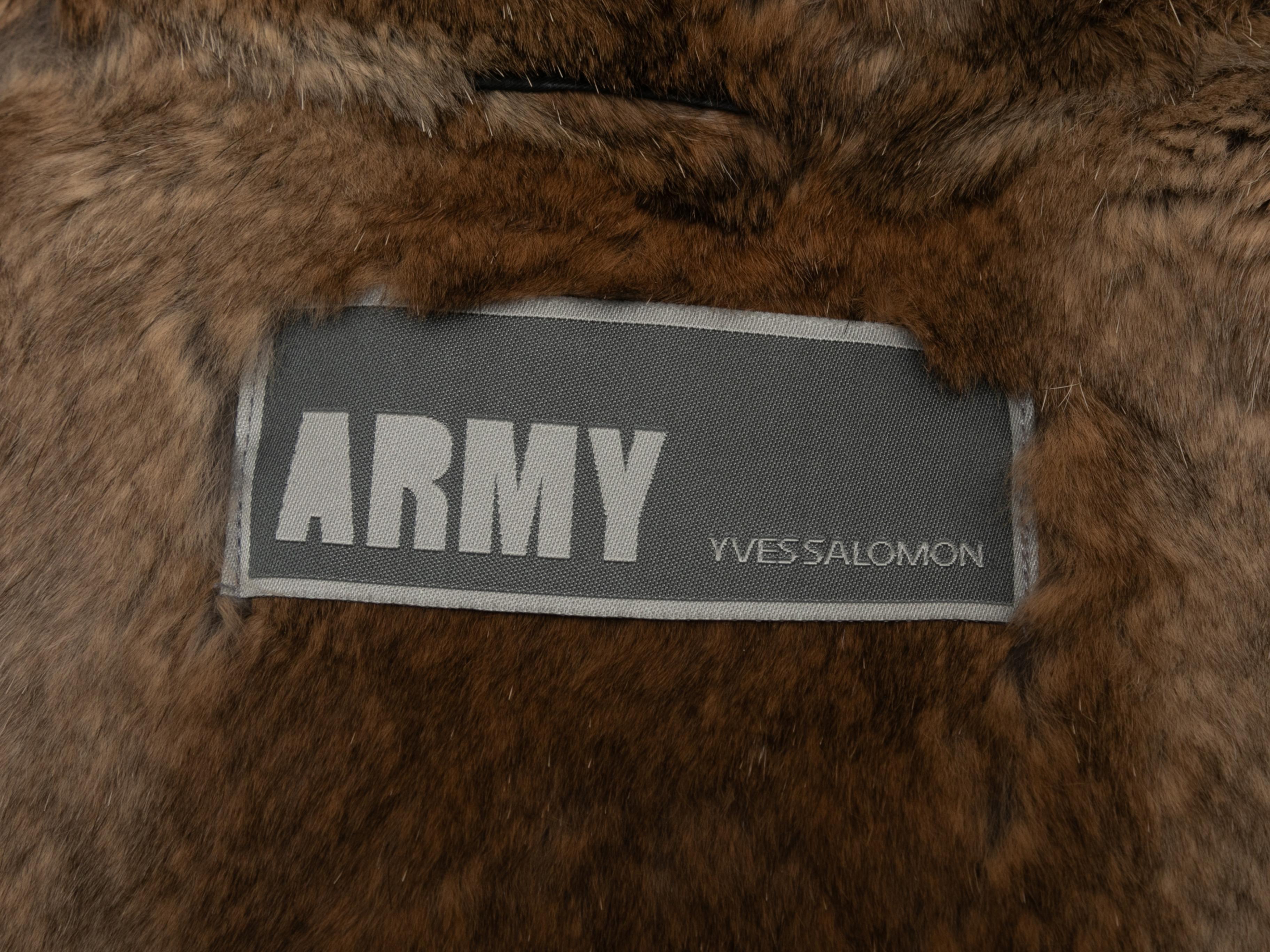 Black fur-lined hooded coat by Yves Salomon Army. Dual hip pockets. Zip closure at center front. 36
