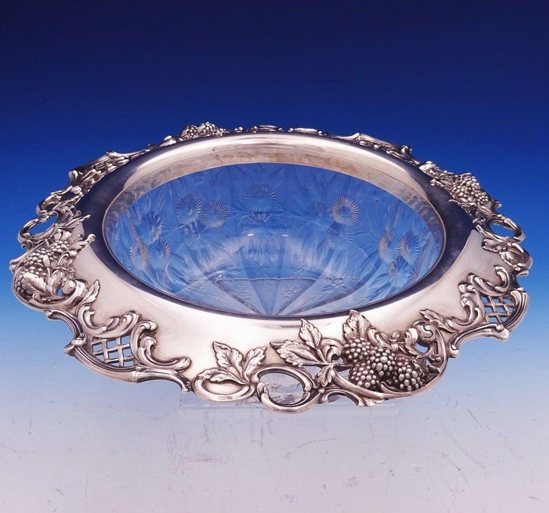 Superb Blackberry by Tiffany & Co. sterling silver and cut glass fruit bowl made with flowers and leaves. The bowl has a C date mark. This piece measures 3 1/4 x 12 in diameter. It is not monogrammed and is in excellent condition. Extraordinary