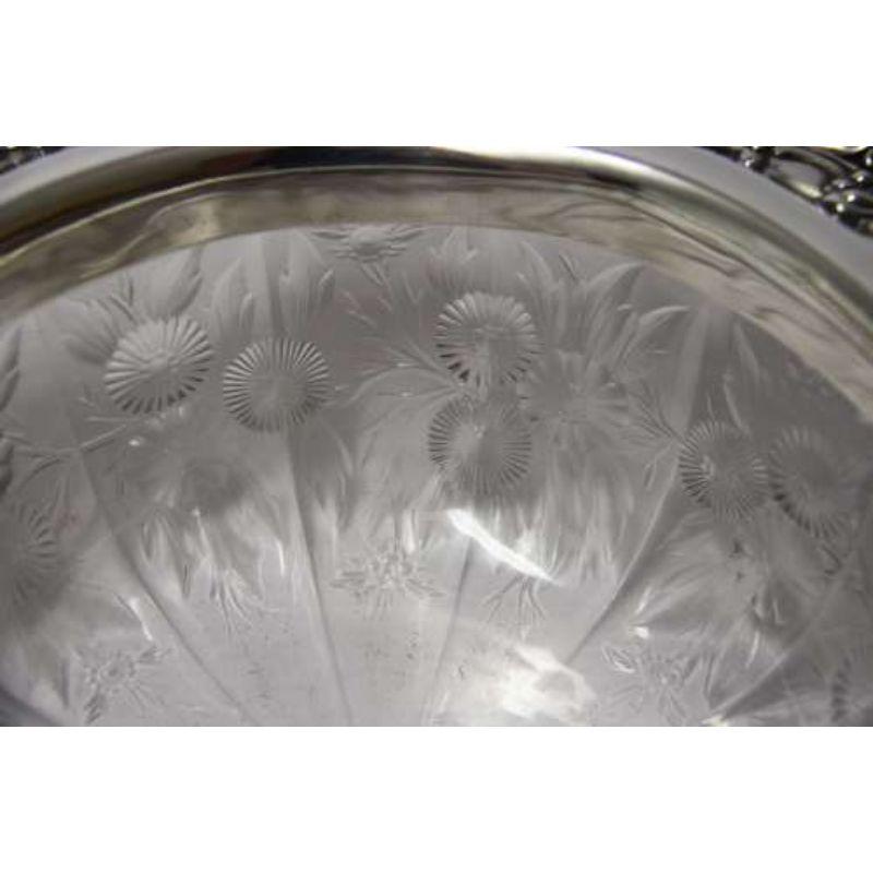 A Tiffany & Co silver and glass bowl,1910

This large and decorative piece was made by the renowned American silversmiths and jewellers Tiffany & Co. It is fully marked under the rim with their name and sterling silver.
This piece comprises a