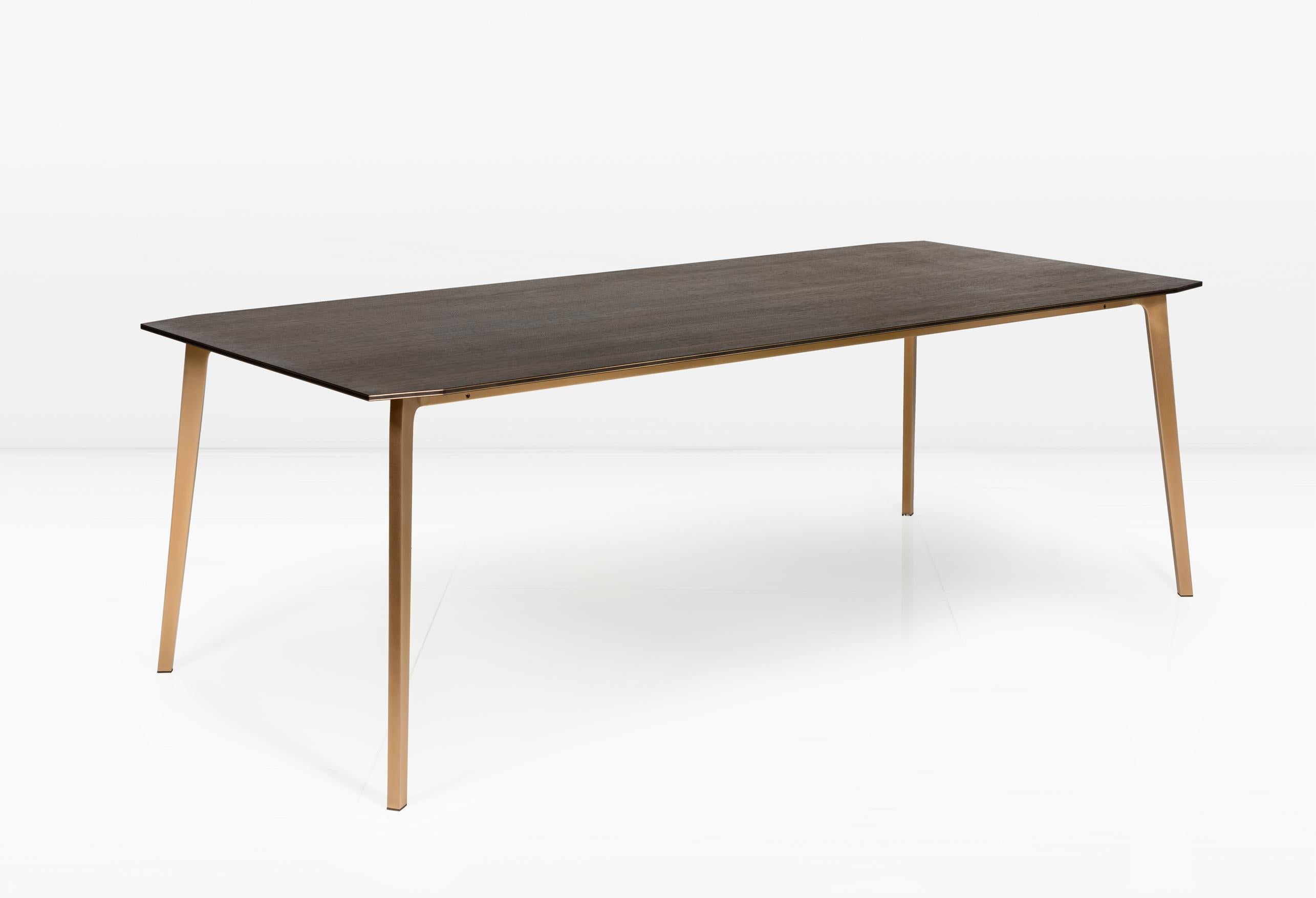 The Blackburn’s top is comprised of alternating layers of wood and metal which are expressed along the table’s edges and subtly articulated at both ends. The Blackburn makes a great dining table or desk. 

The solid metal base is shown in Silicon