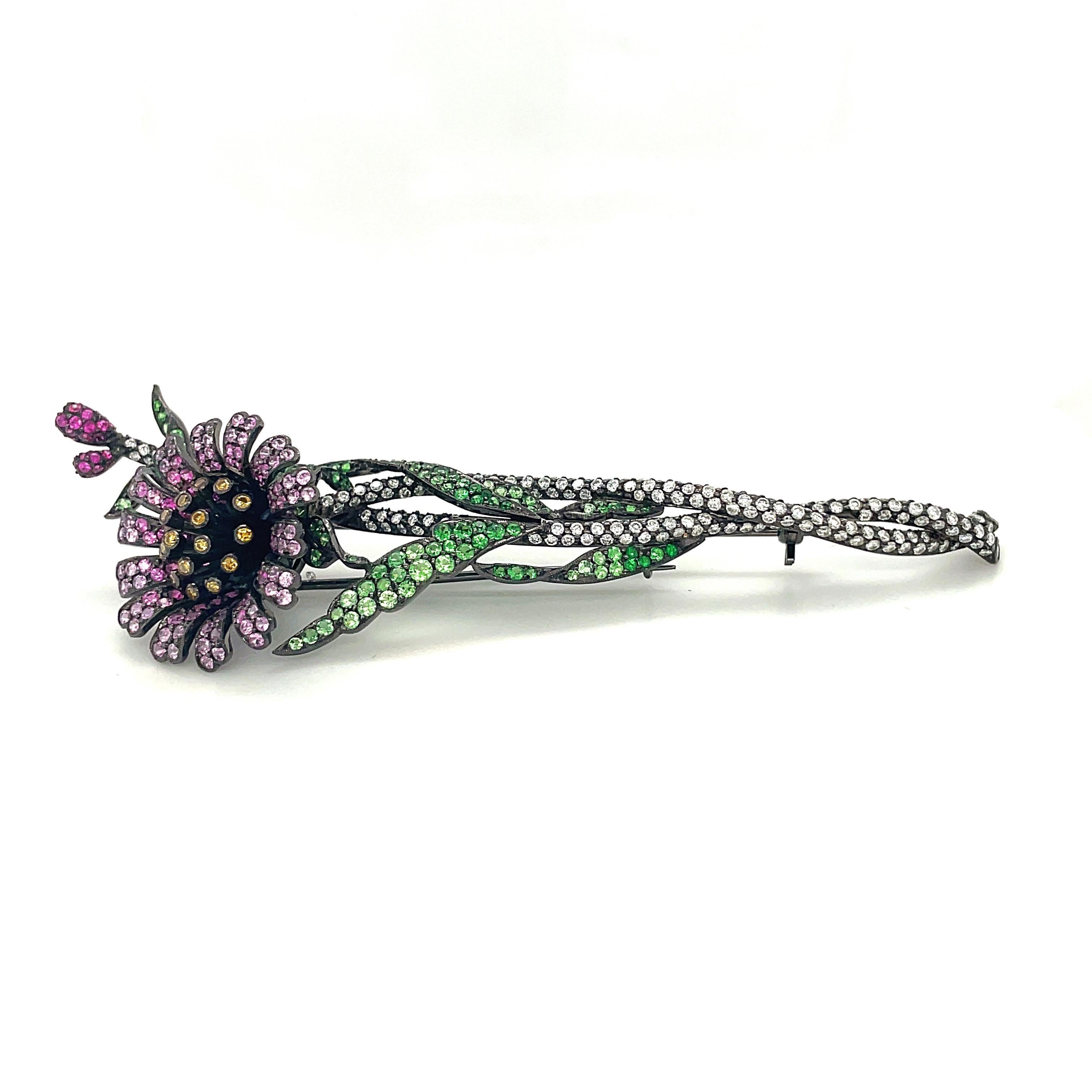 Round Cut Blackened 18kt Gold Flower Brooch with Diamonds, Pink Sapphires and Tsavorite For Sale