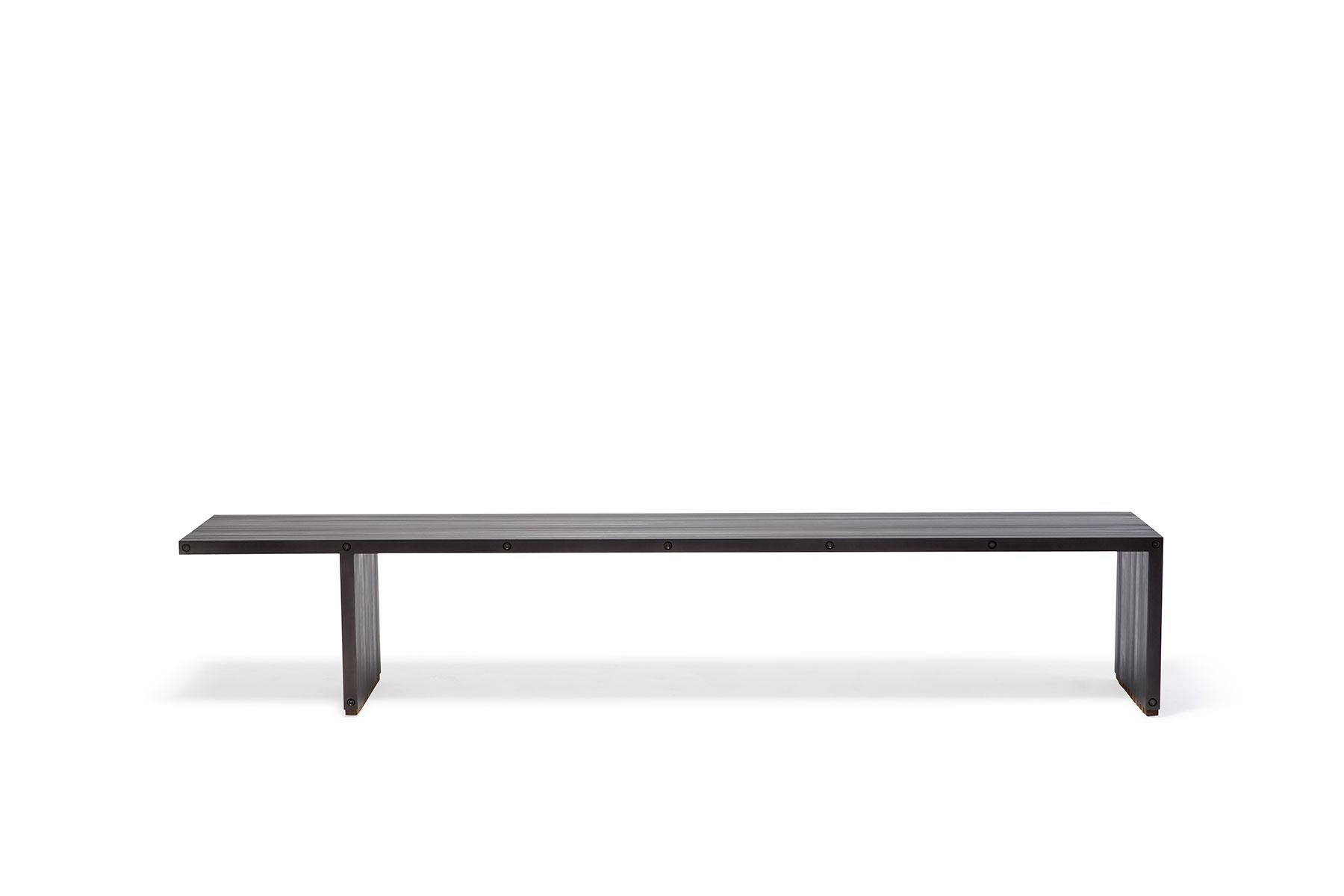 The Compression bench by Stephen Kenn is a celebration of simplicity and strength. The bars are held together without nails or welds, but through compression along steel rods. The Compression Bench can be paired with the matching Compression Table