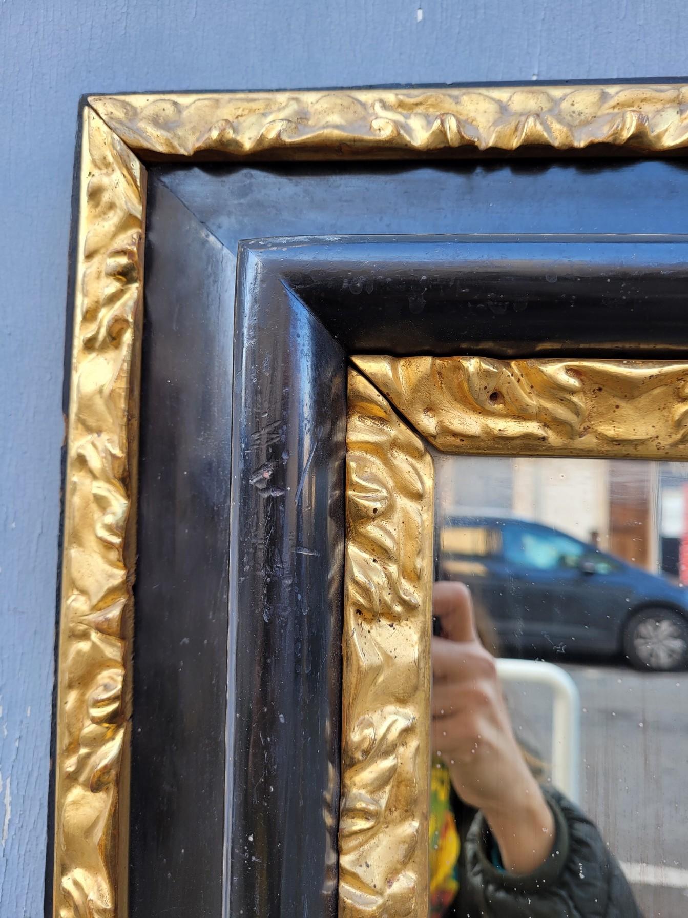 Blackened And Gilded Wooden Mirror, 17th Century For Sale 1