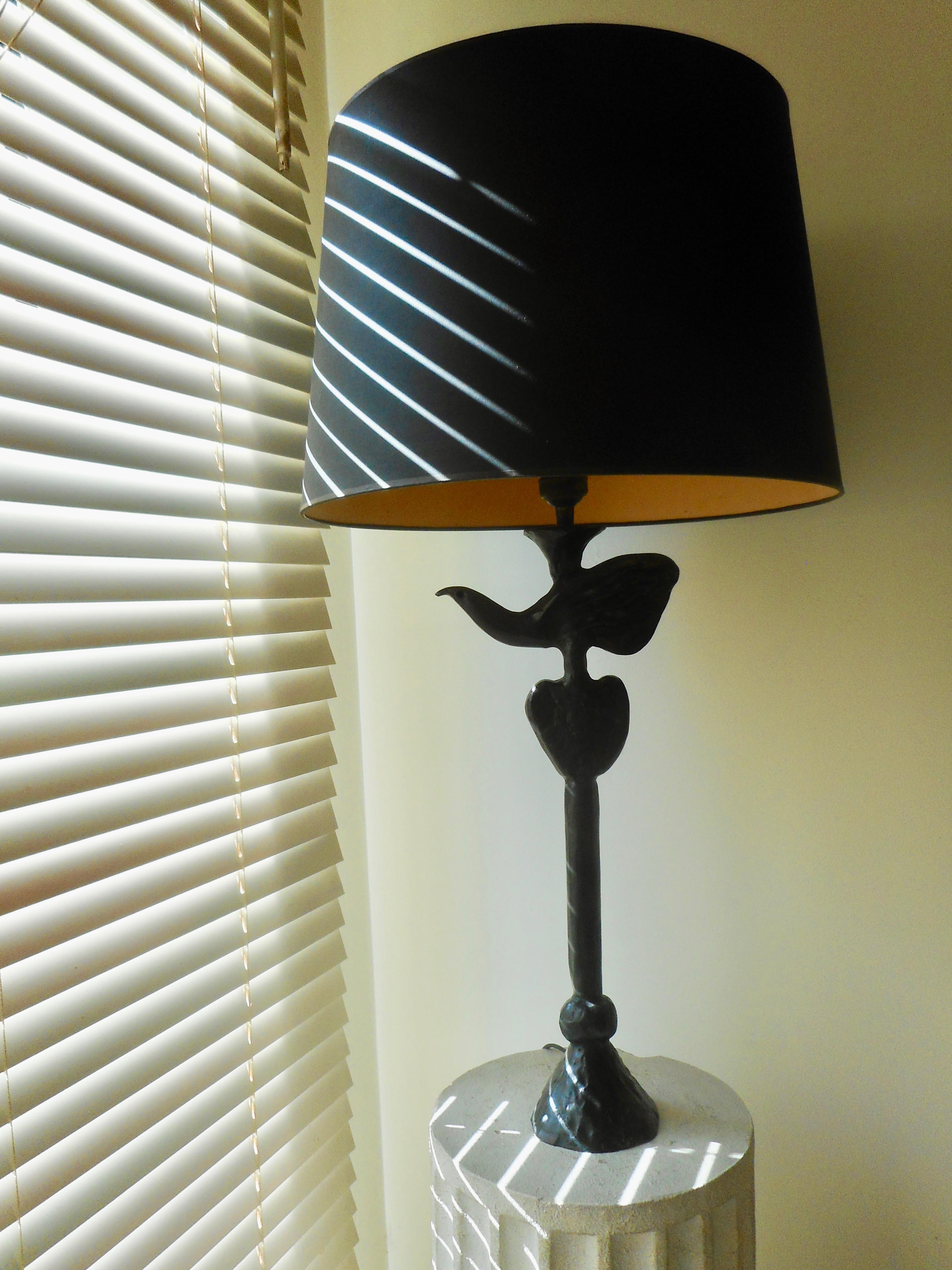 Usually gilded, this lamp is blackened bronze rarer version by Casanove for Fondica.
One light, coming with a black cardboard lampshade.,
circa 1990.