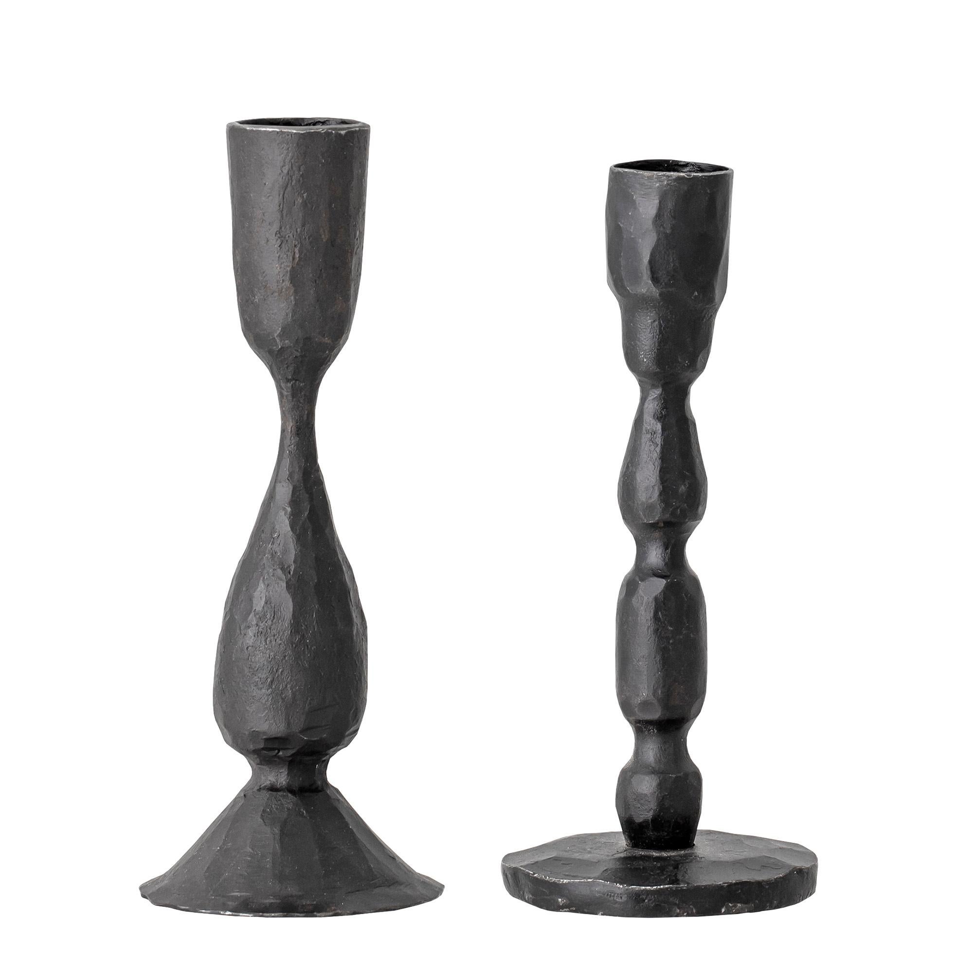 Black cast metal candlestick set of two. Handcrafted, finish values will slightly vary.