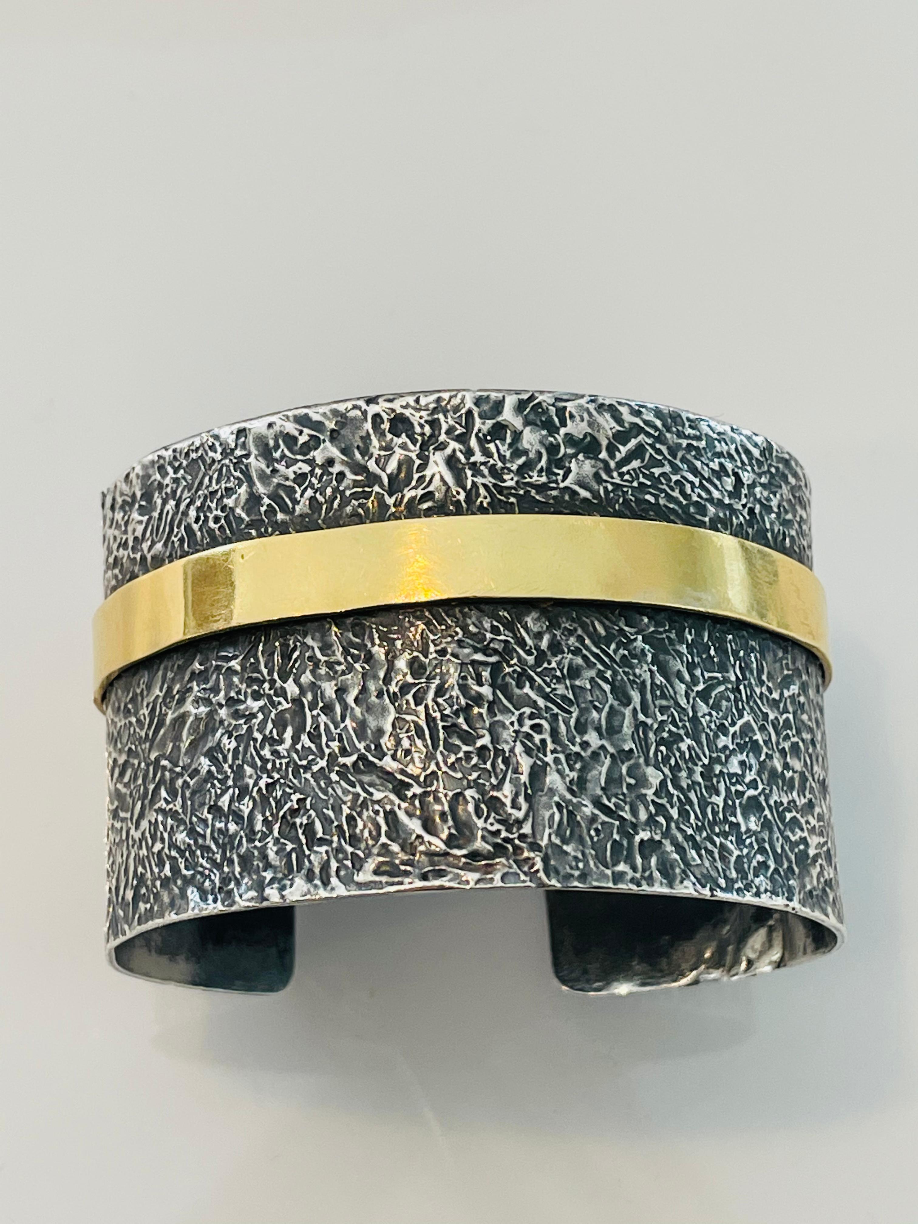 Blackened silver cuff with 22k gold band. Perfect mix of metals for an edgy, classy look! Hand textured, modern classic, one of a kind. Transitions effortlessly from day to night, wear casual or with a LBD. Pairs perfectly with pieces from The