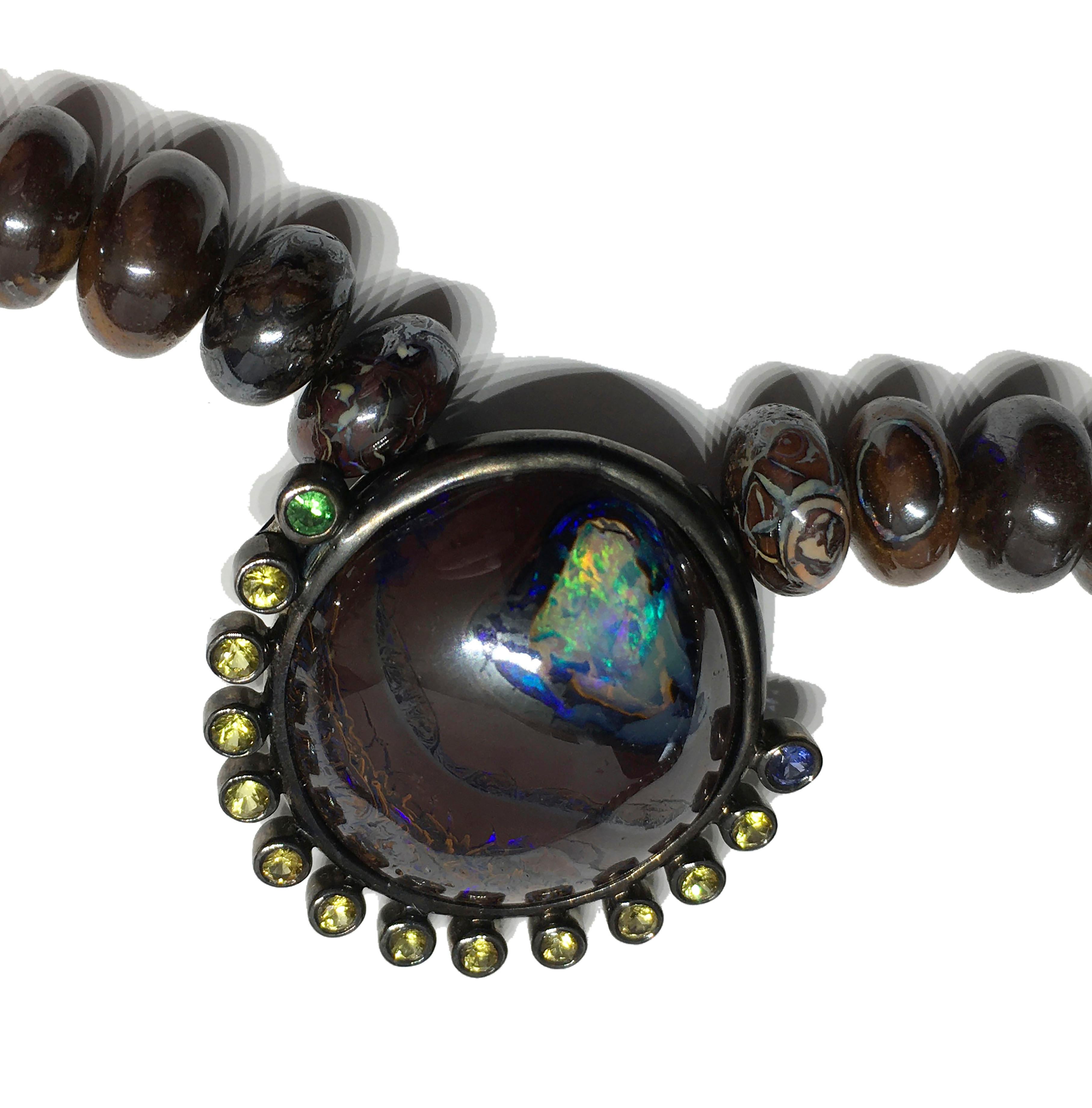 Kary Adam Designed, Blackened Silver Pendant, set with Australian Boulder Opal,  Blue & Yellow Sapphires and Tsavorite Garnet. The Clasp is Gold Plated Silver set with small Amethyst Rounds. The Necklace length is 16