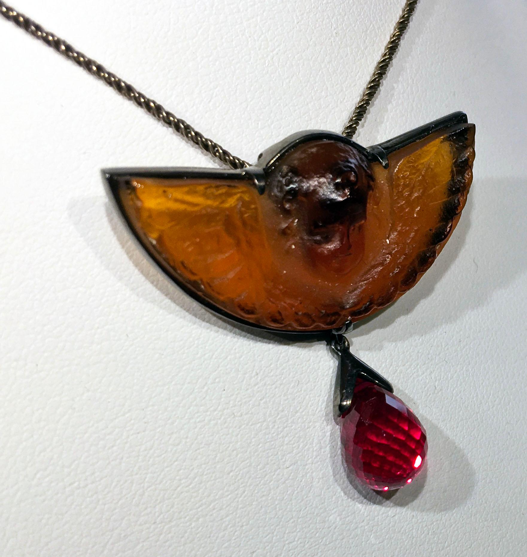 Classical Greek A Pressed Italian Glass and a Cultured Ruby Pendant set in Blackened Silver For Sale