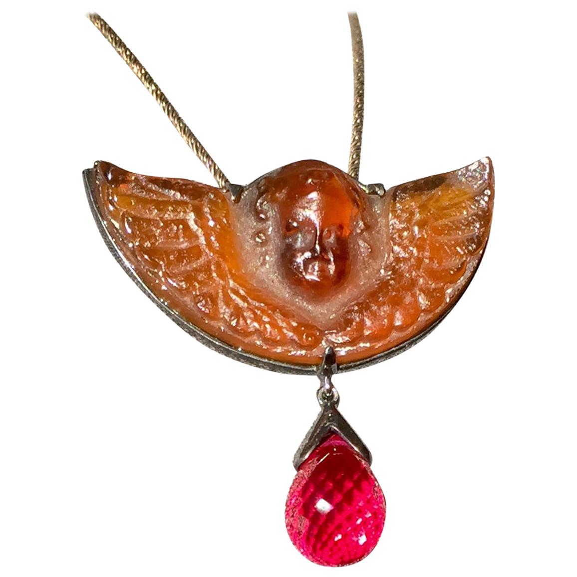 A Pressed Italian Glass and a Cultured Ruby Pendant set in Blackened Silver For Sale