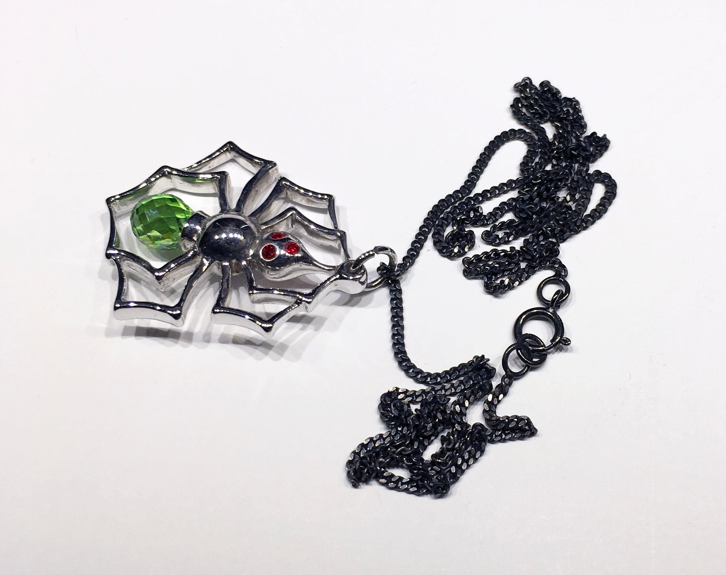 Contemporary Blackened Silver Spider Pendant with Cultured Green Sapphire, and Red Zirconia
