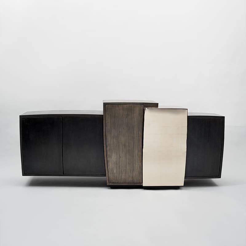 Gary Magakis blackened steel, mirror-polished bronze and textured patinated bronze epitomizes the sculptor’s distinct approach to creating bold and dense geometric forms that simultaneously exude an elegant, buoyant aesthetic of Modernism. At once a
