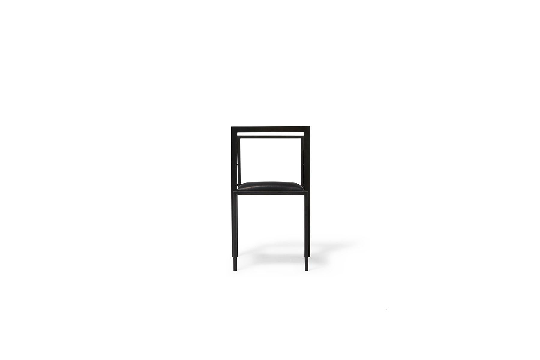 A steel and leather chair with a comfortable seat, easily stackable to save space when needed. This tonal version has a blackened steel frame with a black leather upholstered seat. Sold individually.

Every Stephen Kenn piece is made to order