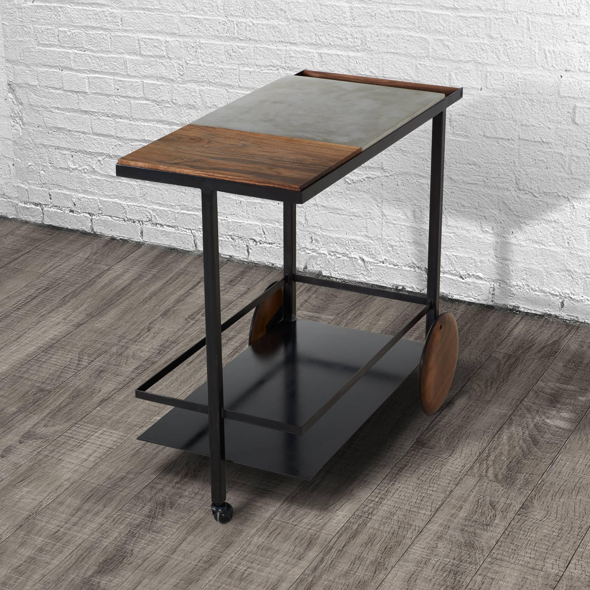 This bar cart is composed of a welded steel frame with lower steel shelf. Upper shelf is a mix of cast-concrete with a removable walnut surface that is finished to be food safe and used as a cutting board or serving tray. The wheels are hand-turned