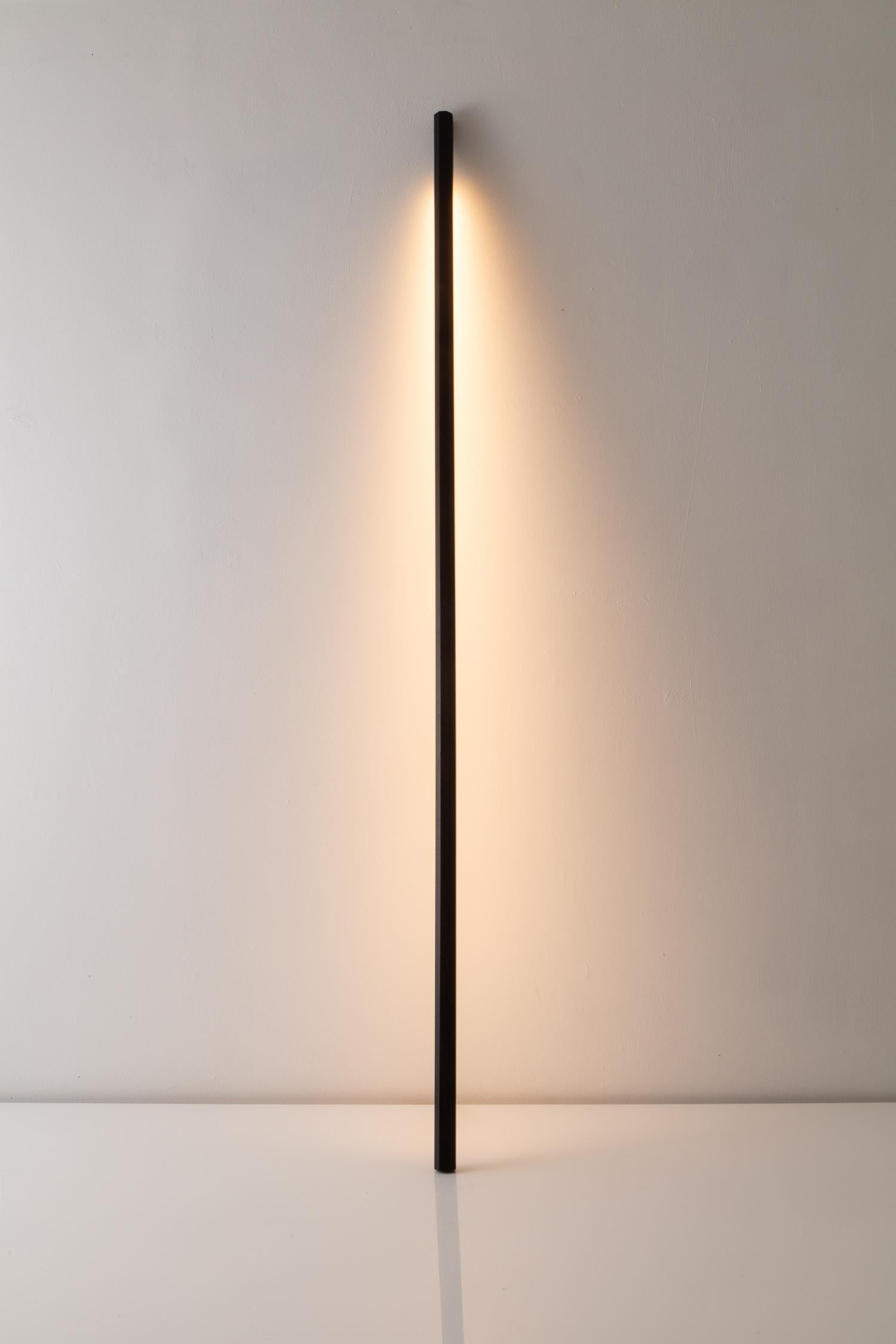 Fort Makers' walnut line light is made in Brooklyn by Noah Spencer. This sculptural LED light juxtaposes hard lines with soft reflected light and emits an ambient aura. The lifespan of an LED strip is approximately 50,000 hours.
12 Volts LED light,