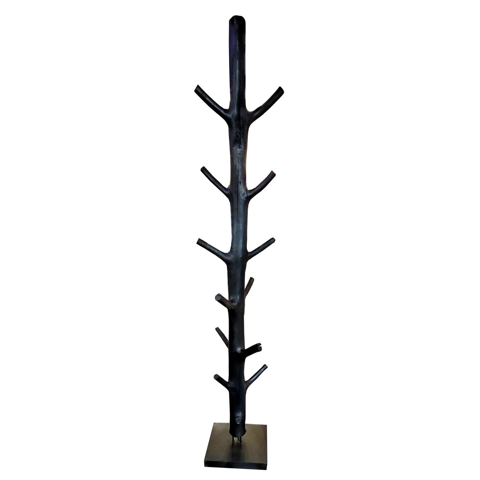 Coatrack blackened wooden tree made with polished natural wood
tree with black painting. On black iron base. Each piece is unique and 
may vary slightly.
