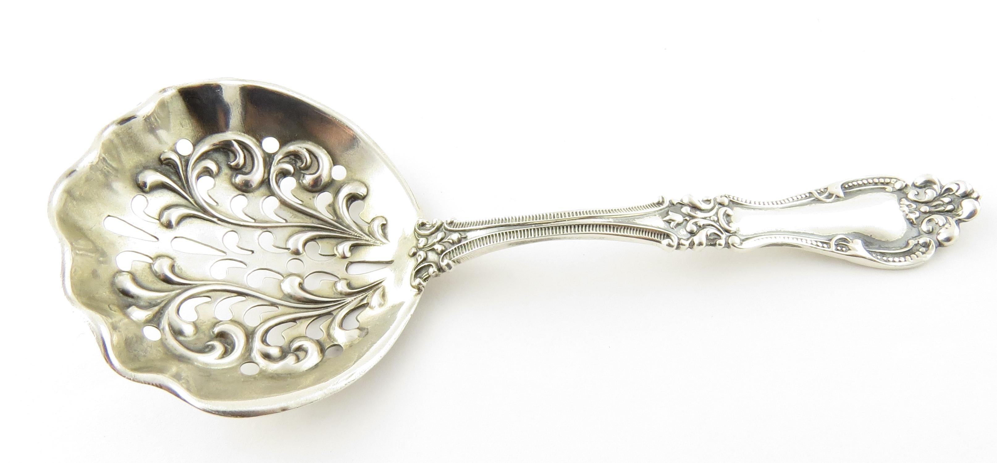 Blackinton Sterling silver bon bon spoon in the 1900 Helena pattern. 
Marked: B with sword through it, STERLING. 
No monogram. 
Measures 4 3/4