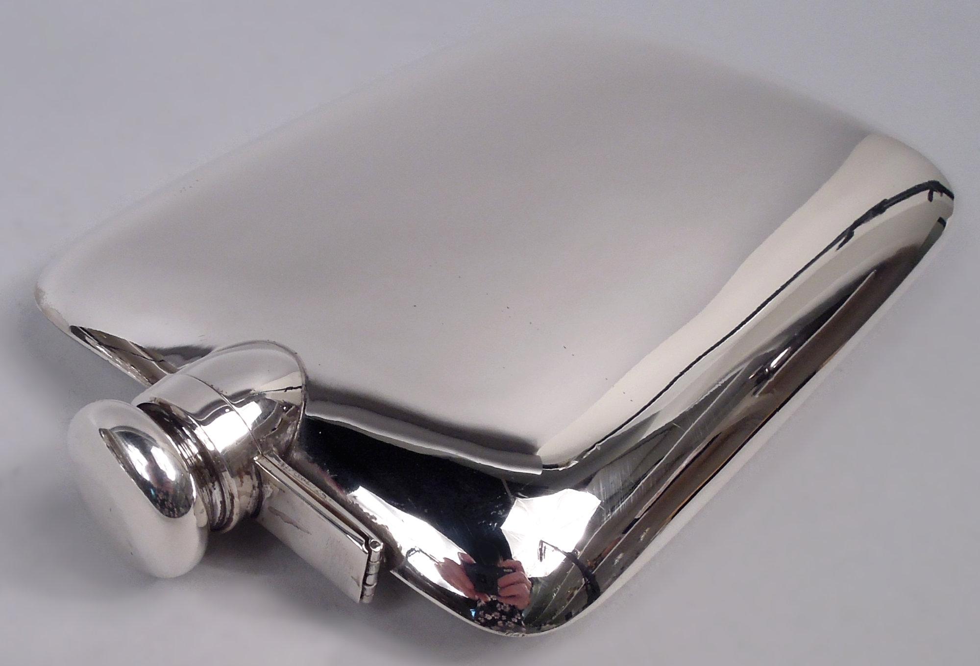 Modern sterling silver flask. Made by R. Blackinton & Co. in North Attleboro, Mass., ca 1920. Rectangular and curved with round corners; hinged and cork-lined bayonet cover. Wide hand-spanned required. Fully marked including maker’s stamp, no. 9713,